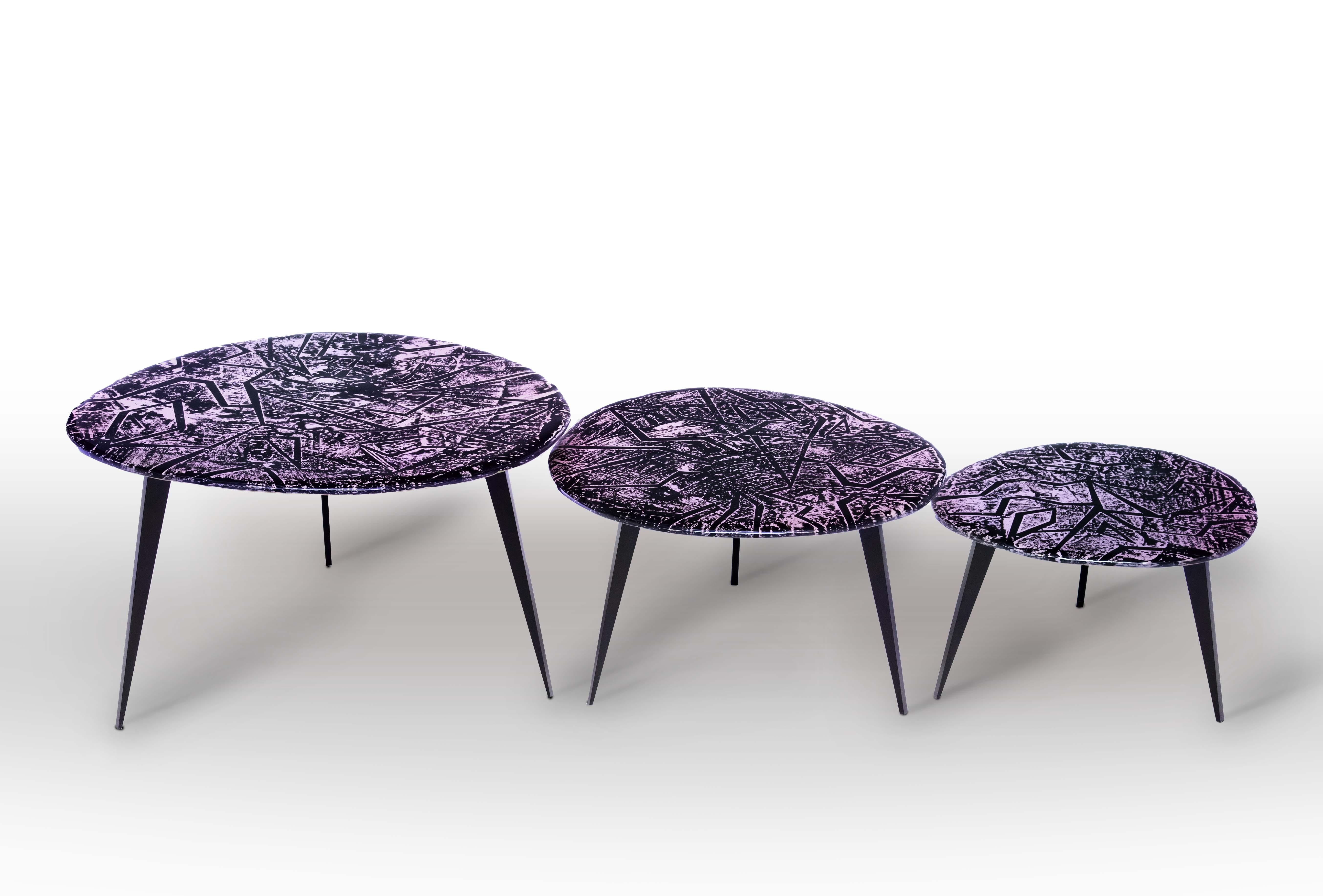 Each table is a unique piece. It is handmade by the artist with the utmost care and attention to detail. The entire support structure is made of brass with matt black finish. The top is hand-engraved crystal at the bottom (15 mm thick). The design