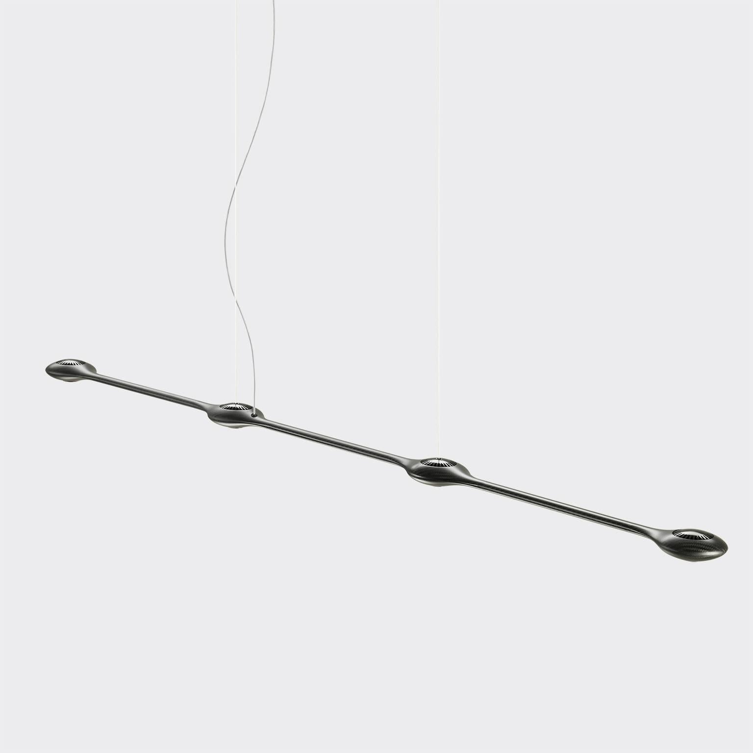 Stunning beauty powered by the latest technology. Carbon Light is a high-performing modular suspension light made using the latest LED technology. A feather-light carbon fiber body links highly efficient power LED spots. With an adaptable design and