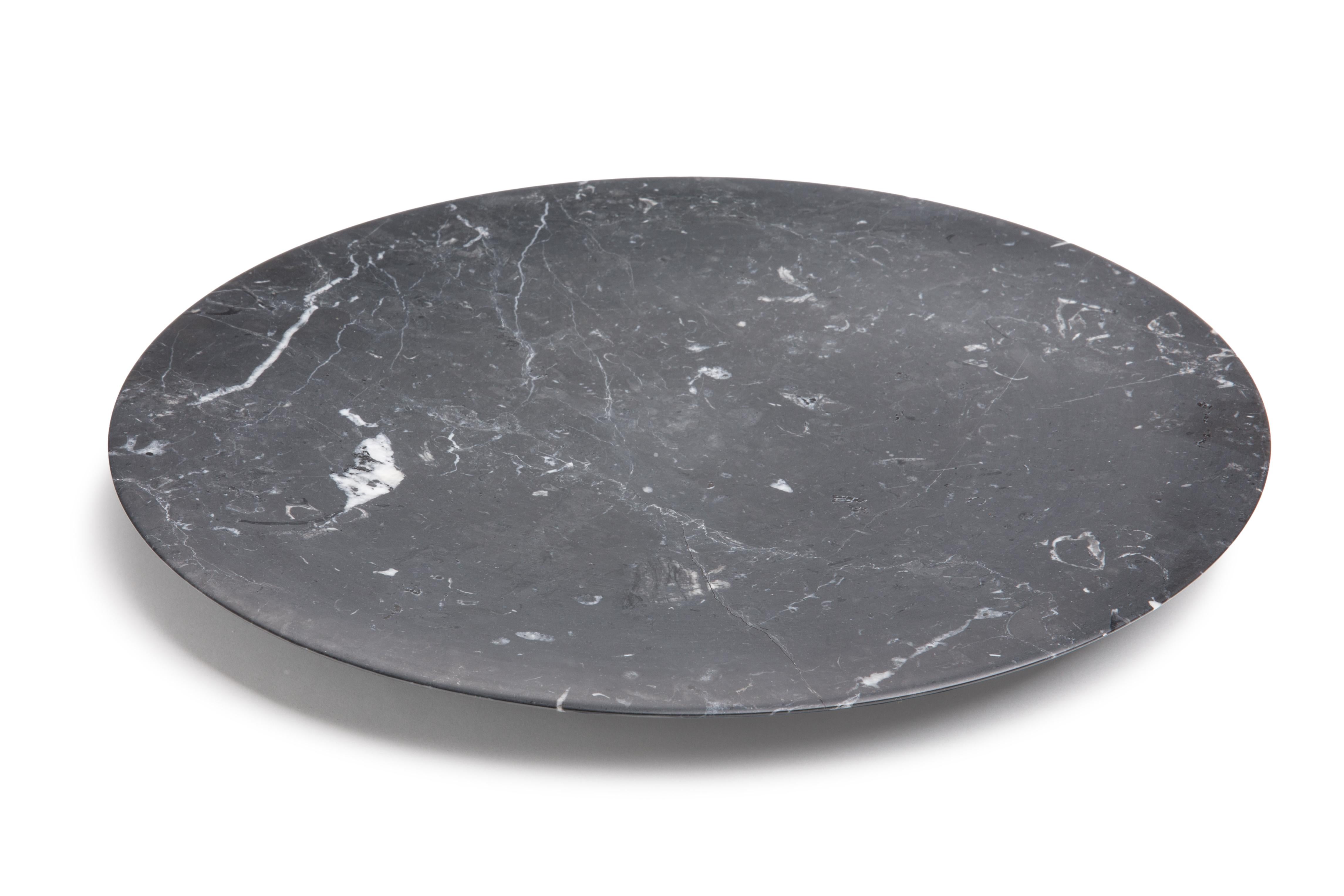 This stunning tray, made from Black Carnico marble, evokes the Renaissance concept of man being at the center of space and nature with its circular shape. The circle is rich in symbolism in European history and art. The fusion of these two elements