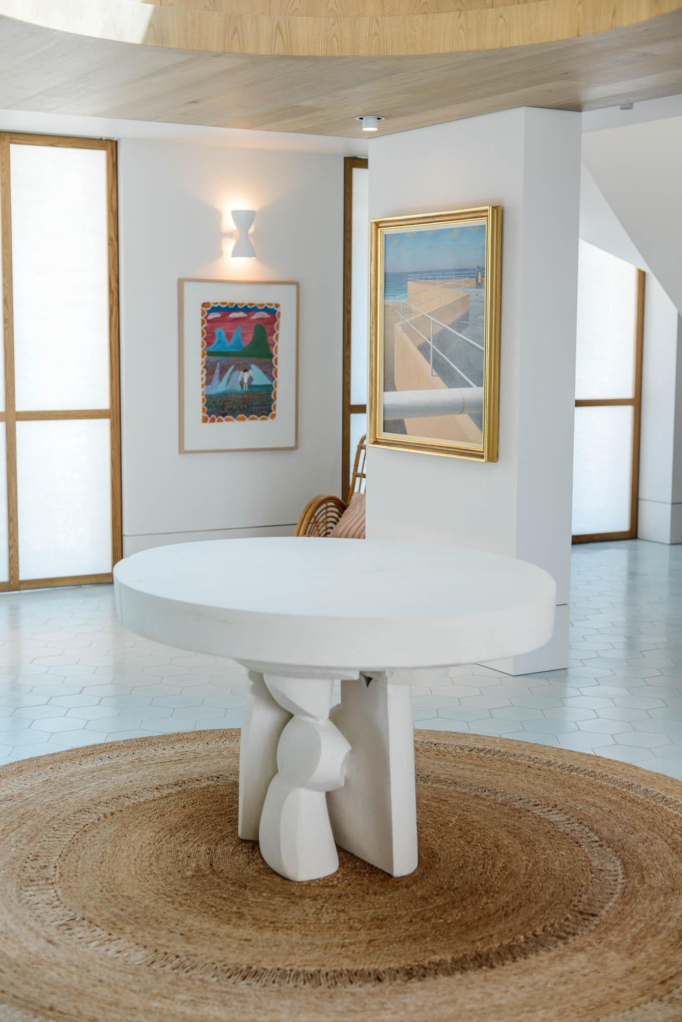 Contemporary table in limestone 'Sydney' by denHolm.

Each creation is unique and signed by the artist.

Dimensions:
H. 80 cm
W. 120 cm
D. 120 cm

Material:
South Australian Limestone, sculpted entirely by hand.
---
Artist and stonemason Steve Clark
