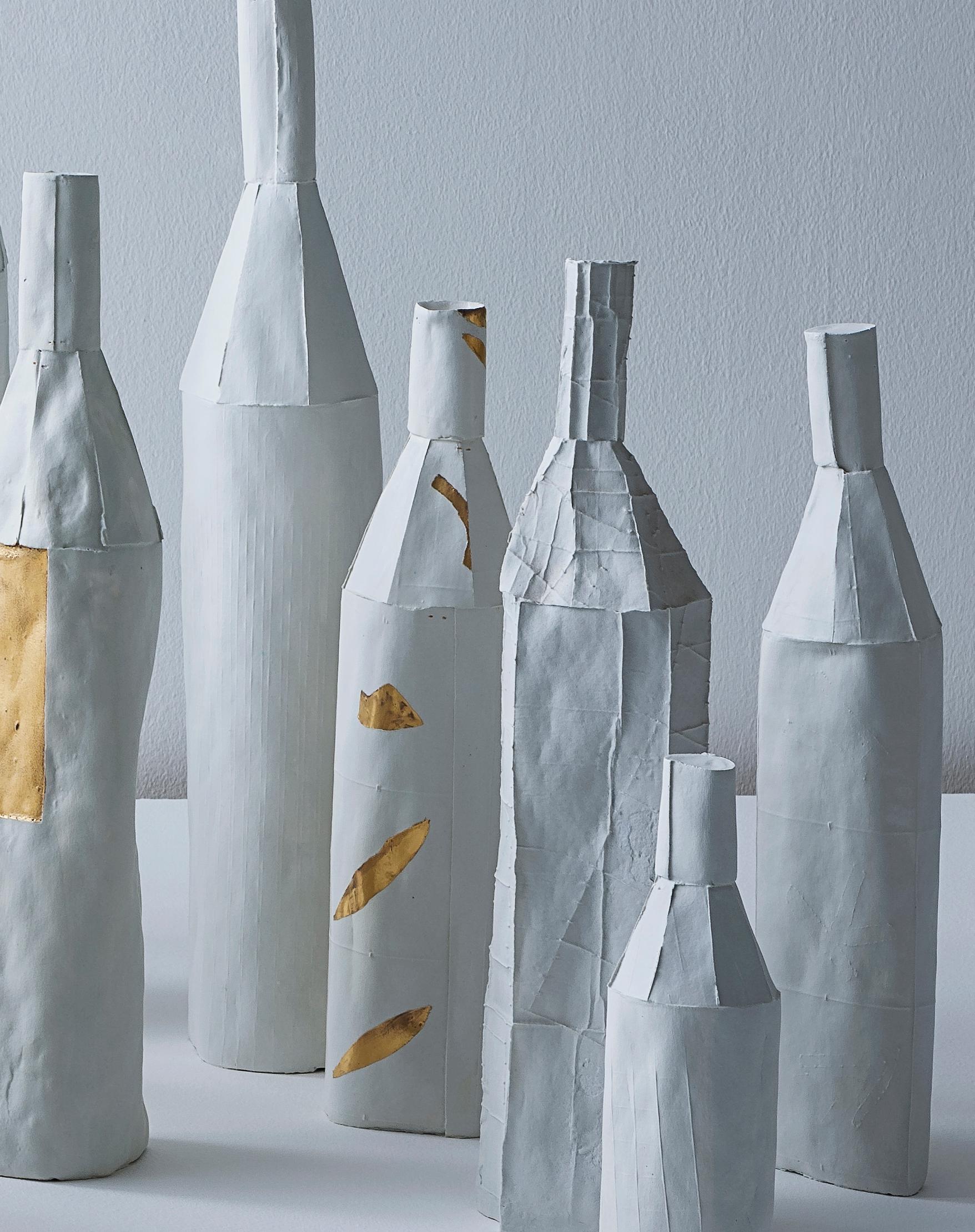 With its unique texture and one-of-a-kind quality, this bottle will be a refined accent on a table, shelf or console in any dècor. Handcrafted of paper clay (ceramic mixture enriched with paper pulp), this sculpture has a smooth surface in bright