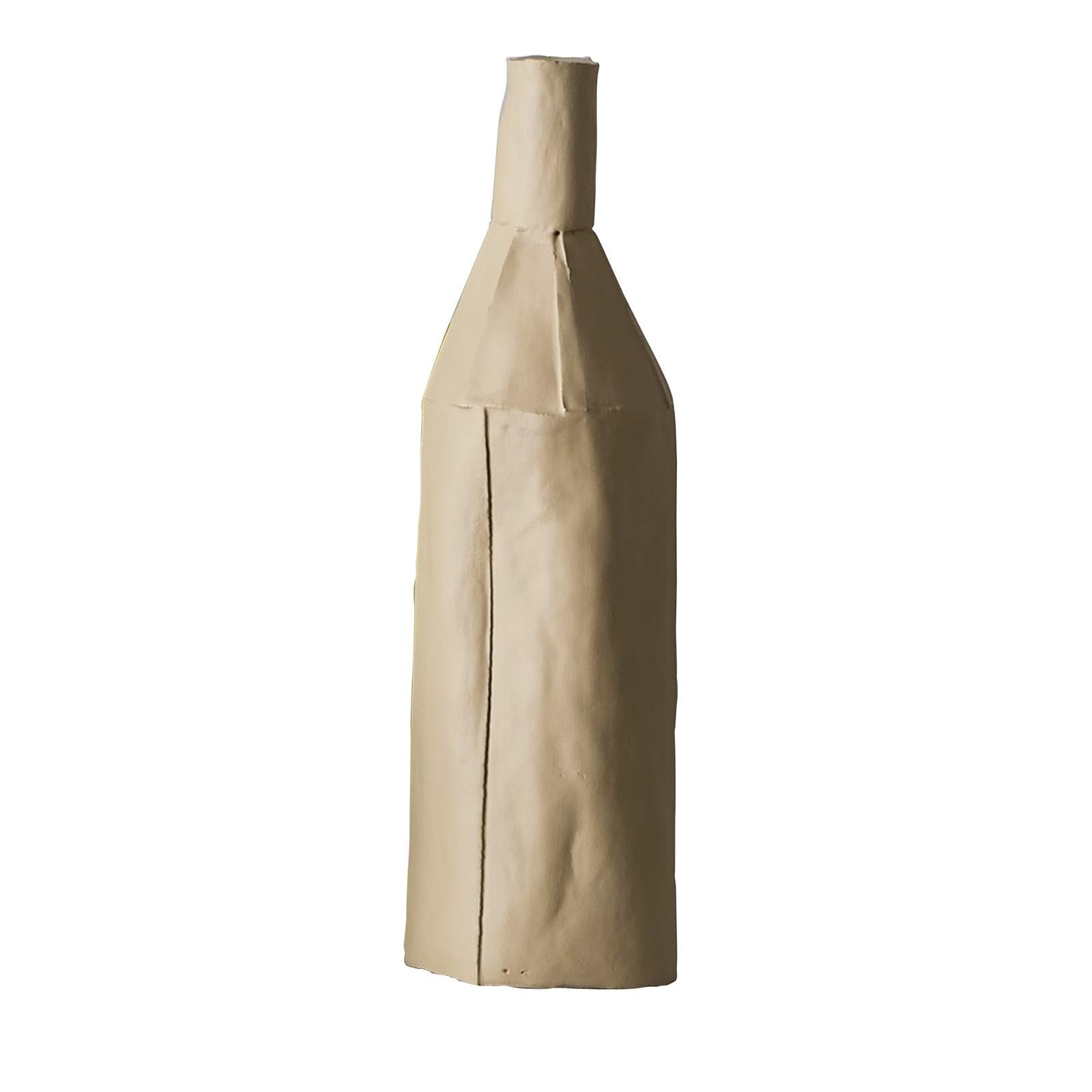 Part of the exclusive Cartocci collection, this bottle-shaped sculpture was handcrafted using paper clay, a clay-base mixture enriched with natural fibers to make it more pliable during the molding phase. The piece assumes its distinctive,