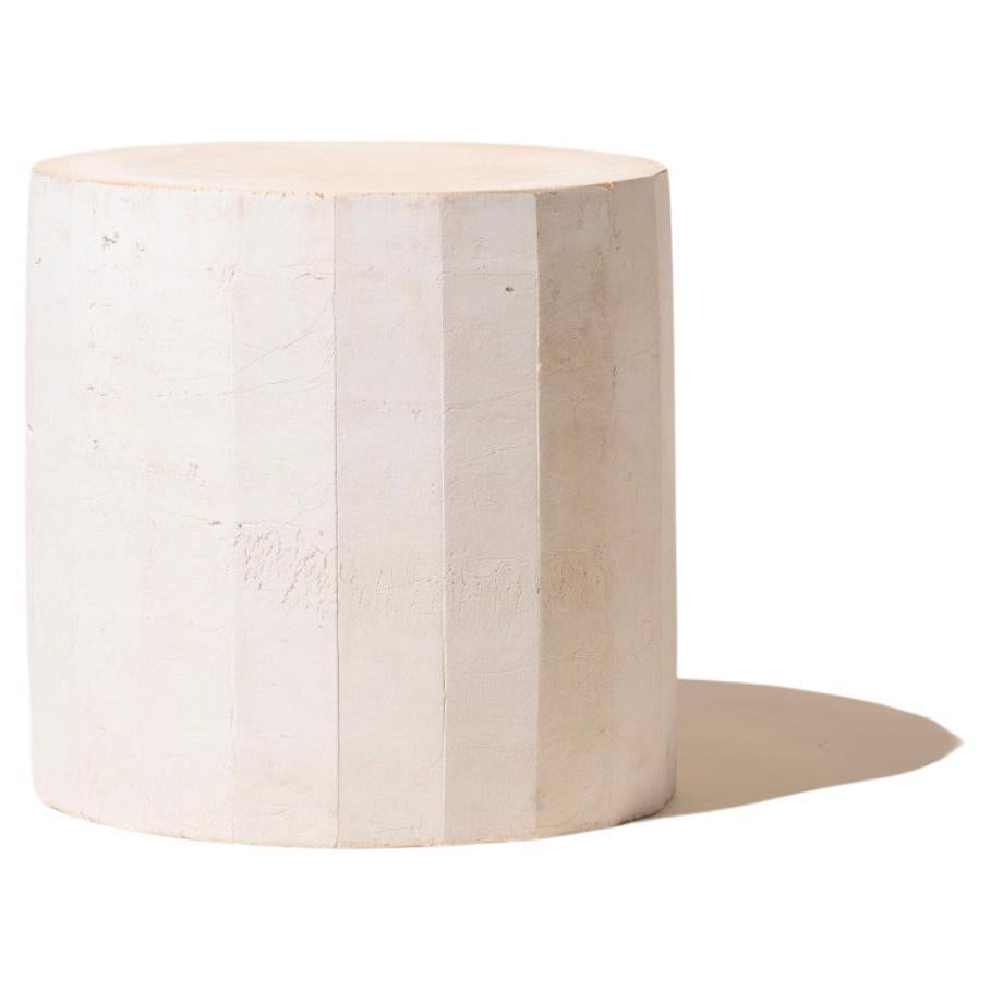 Handmade earthenware facetated side table manufactured at the workshop of Apparatu in Barcelona. Different clay bodys are mixed with natural fibers like corn, straw, or heather straw. The pieces are casted by hand, creating a thick and strong clay