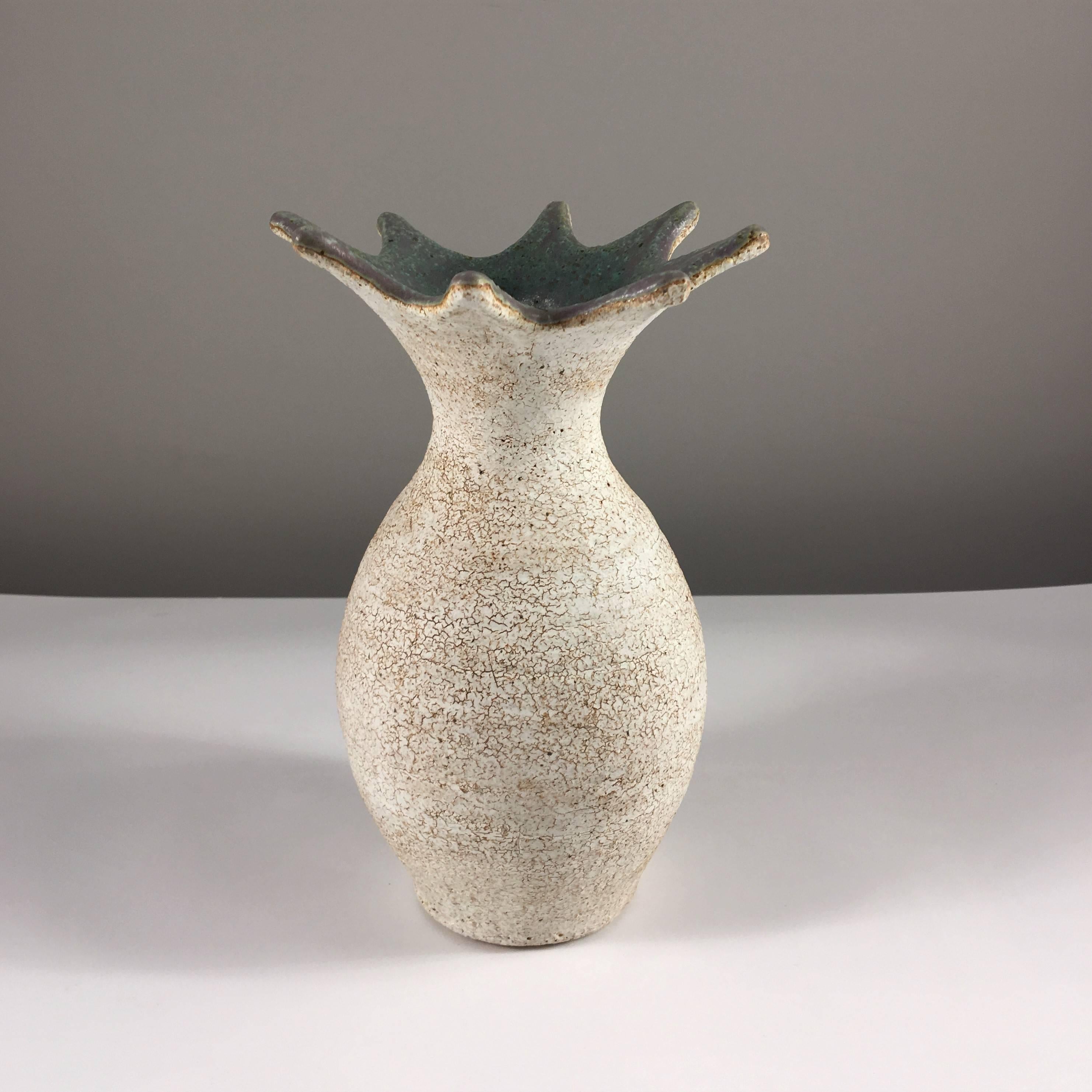 Contemporary ceramic artist Yumiko Kuga's glazed stoneware flared vase no. 215 is part of her Crackle series. All of the pieces in this series are hand-built and 100% handmade so they are one-of-a-kind and thus vary slightly from one another. All