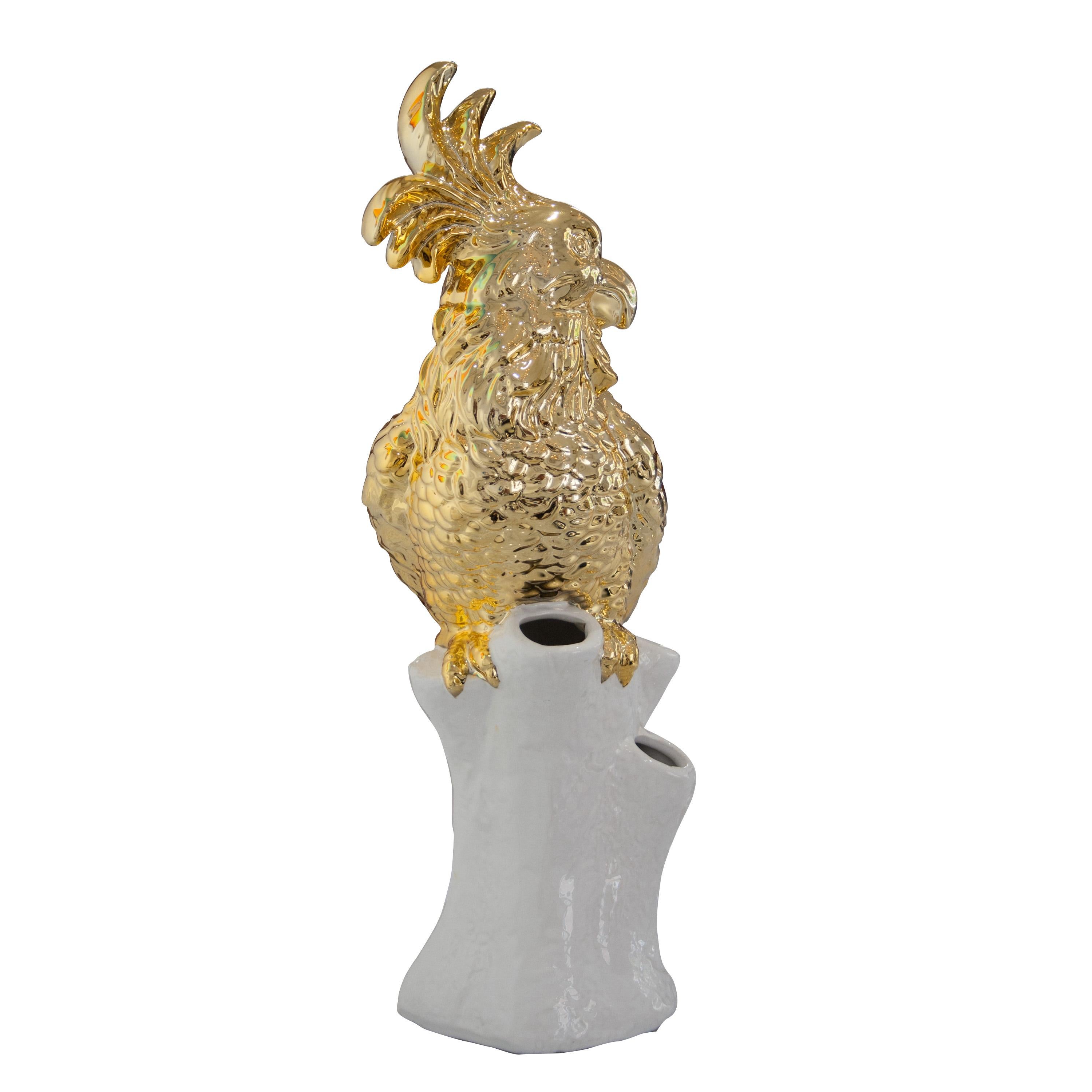 Ceramic vase in the shape of a cockatoo in white and gold finish. Three holes for flowers.