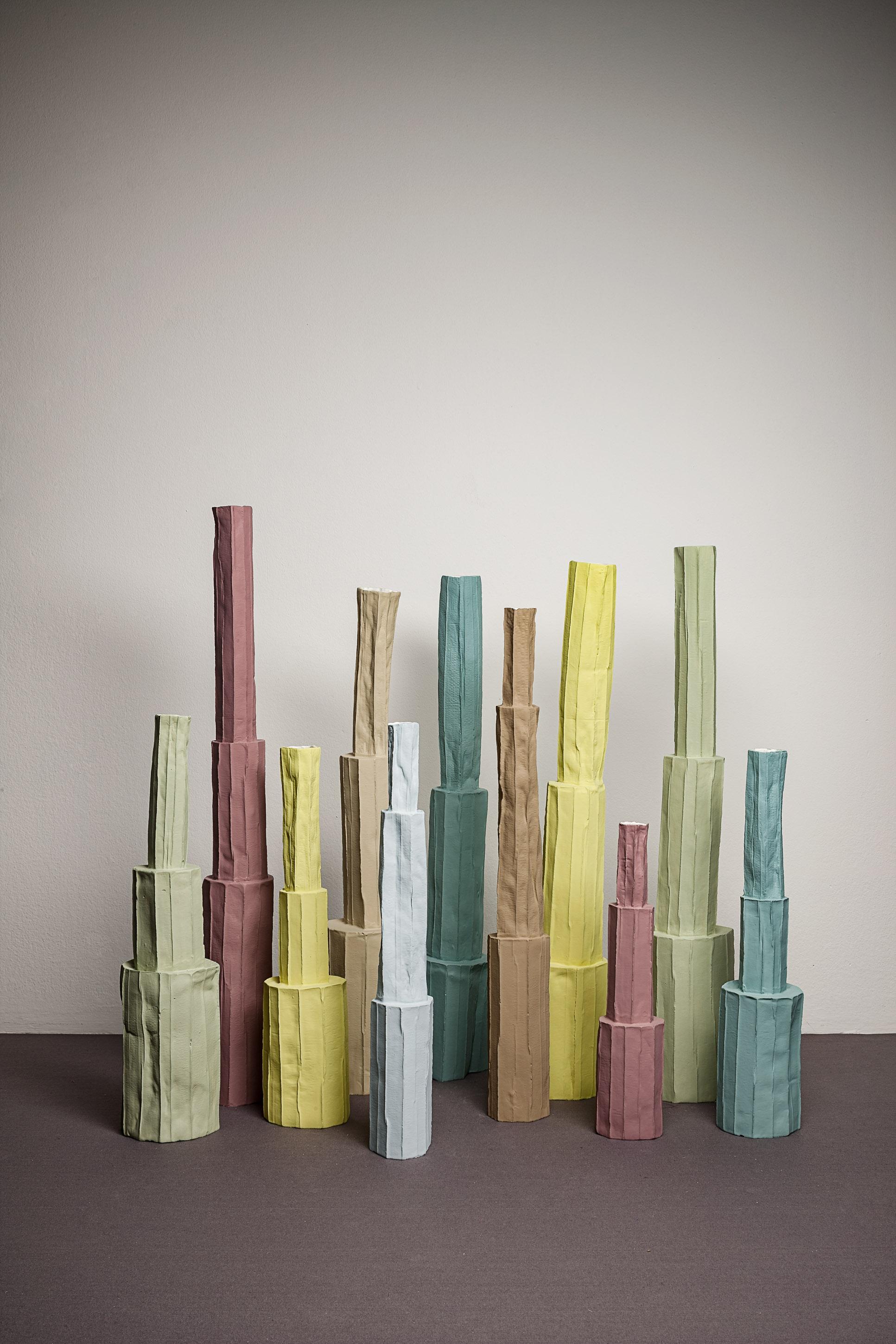 This remarkable piece is part of the Pistillo series of sculptures inspired by flower pistils, handcrafted of paper clay (mixture of clay and paper pulp) using traditional techniques. Finished in varying colors, this unique vase features a large