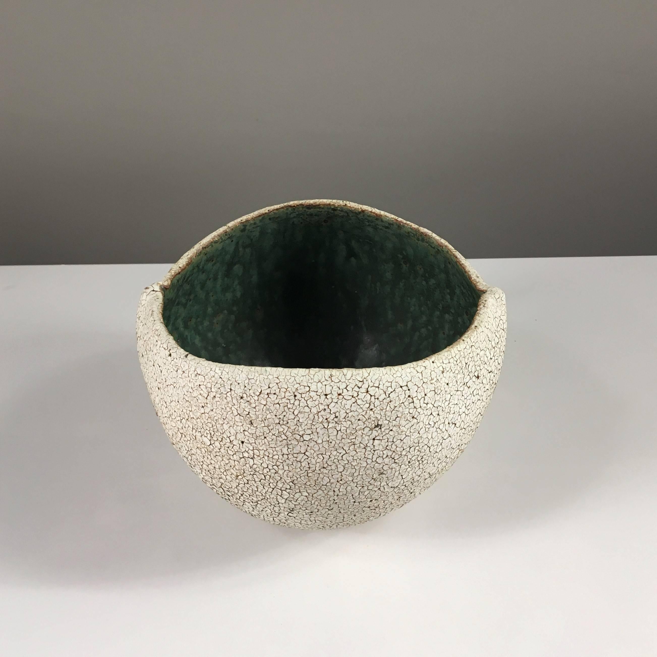 Contemporary ceramic artist Yumiko Kuga's glazed stoneware round bowl no. 170a is part of her Crackle Series. All of the pieces in this series are hand-built and 100% handmade so they are one-of-a-kind and thus vary slightly from one another. All