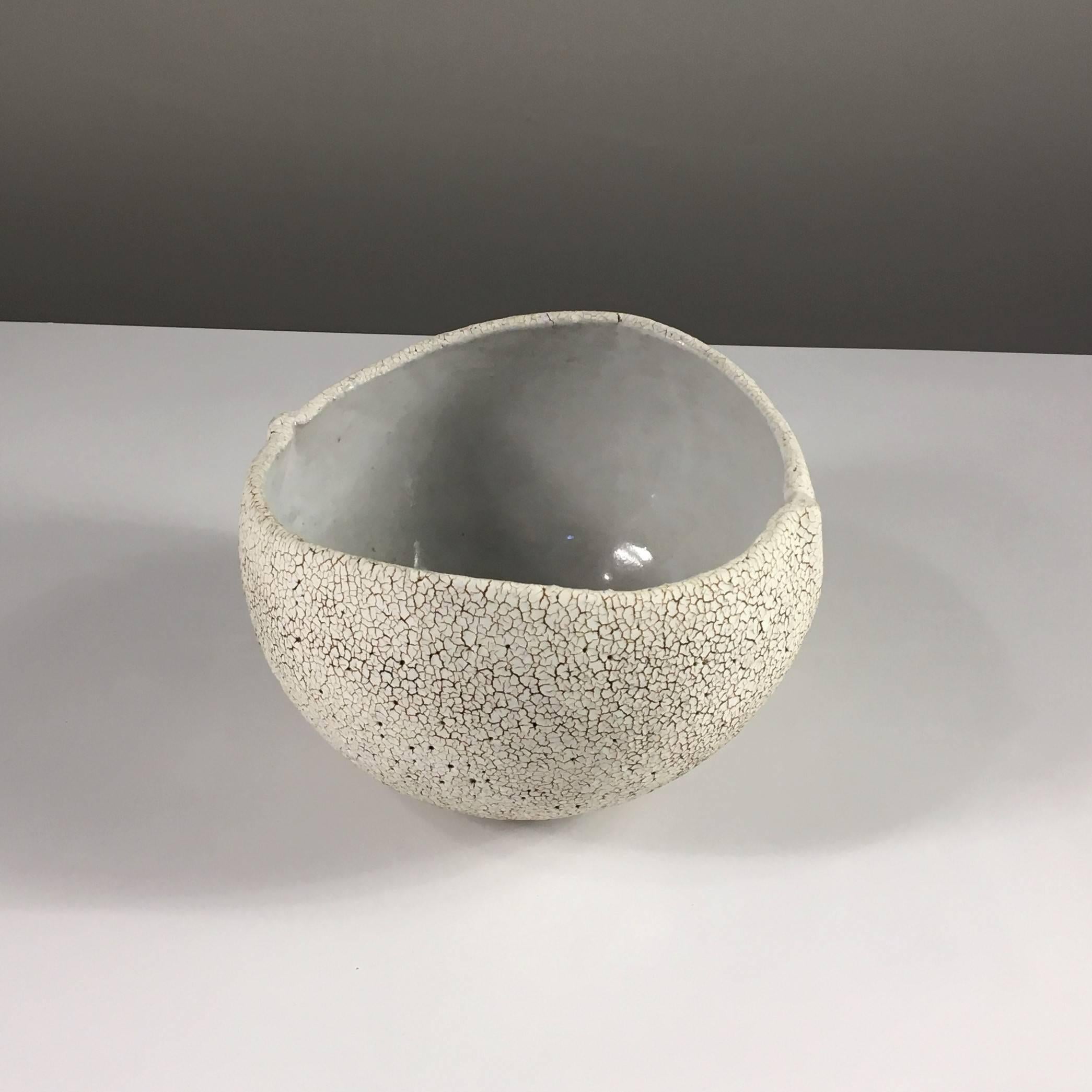 Contemporary ceramic artist Yumiko Kuga's glazed stoneware round bowl no. 171 is part of her Crackle series. All of the pieces in this series are hand-built and 100% handmade so they are one-of-a-kind and thus vary slightly from one another. All