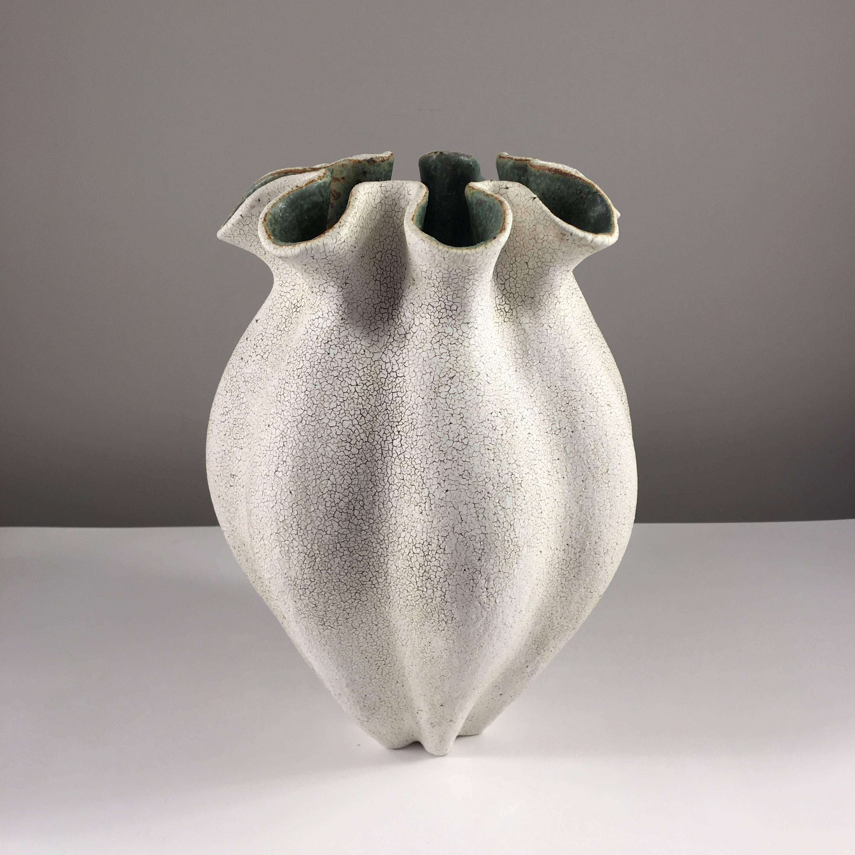 Contemporary ceramic artist Yumiko Kuga's glazed stoneware ruffled neck vase no. 181 is part of her Crackle Series. All of the pieces in this series are hand-built and 100% handmade so they are one-of-a-kind and thus vary slightly from one another.