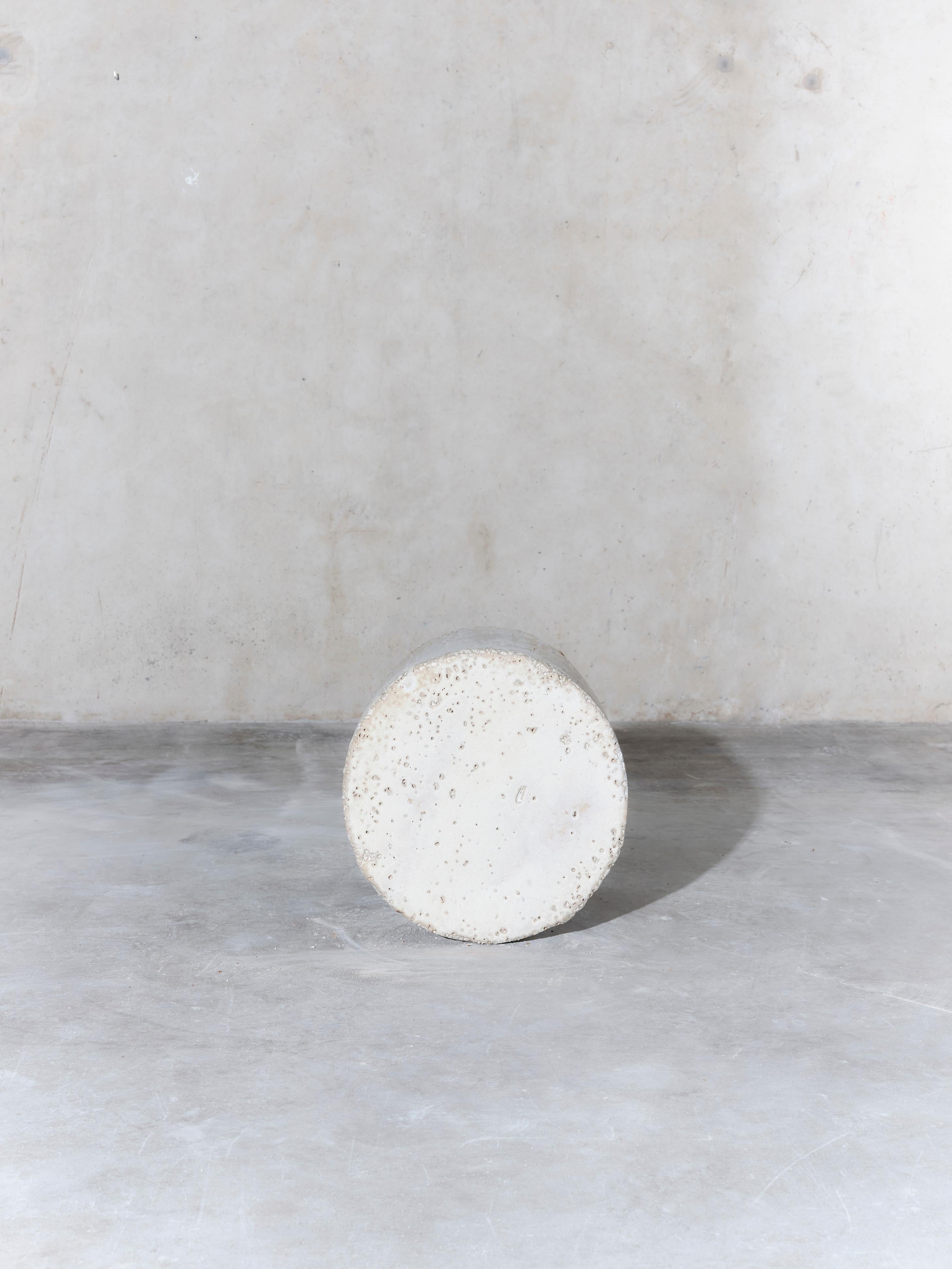 Unique handmade stoneware side table manufactured at the workshop of Apparatu in Barcelona. Different clay bodys are mixed with natural fibers like corn, straw, or heather straw. The pieces are casted by hand, creating a thick and strong clay