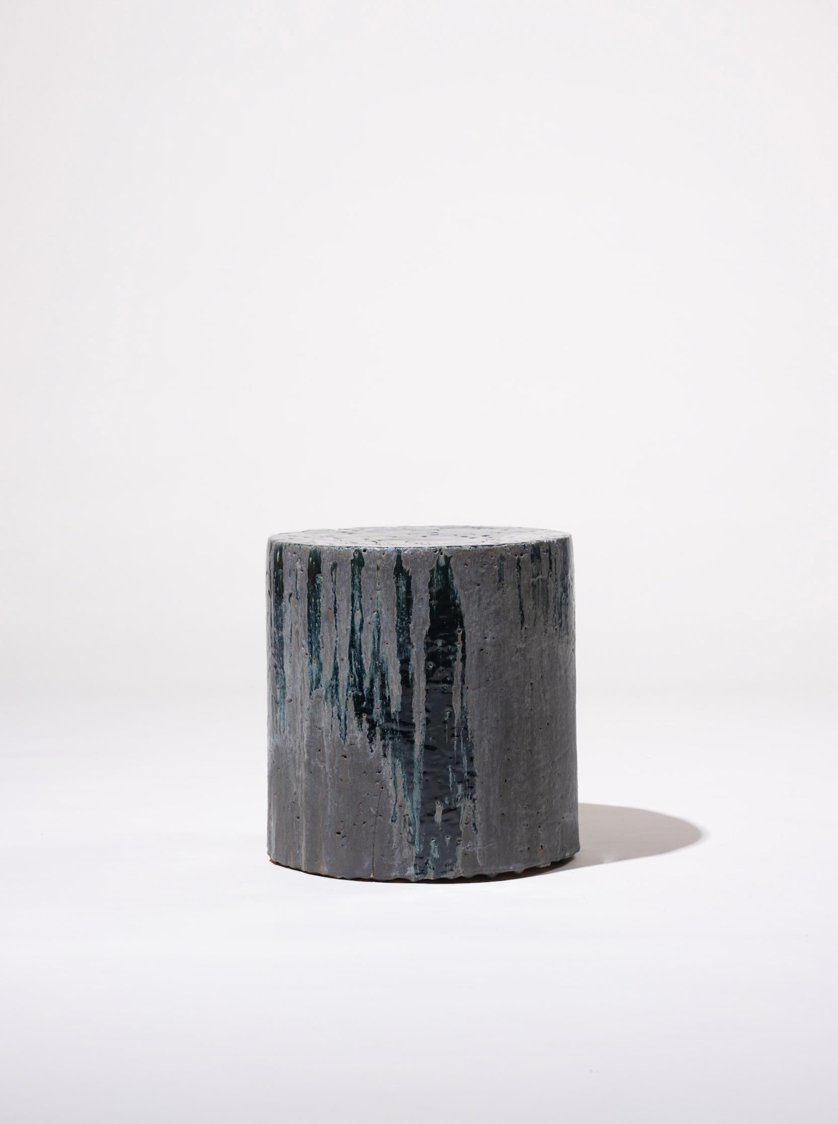 Handmade stoneware side table manufactured at the workshop of Apparatu in Barcelona. Different clay bodys are mixed with natural fibers like corn, straw, or heather straw. The pieces are casted by hand, creating a thick and strong clay structure.