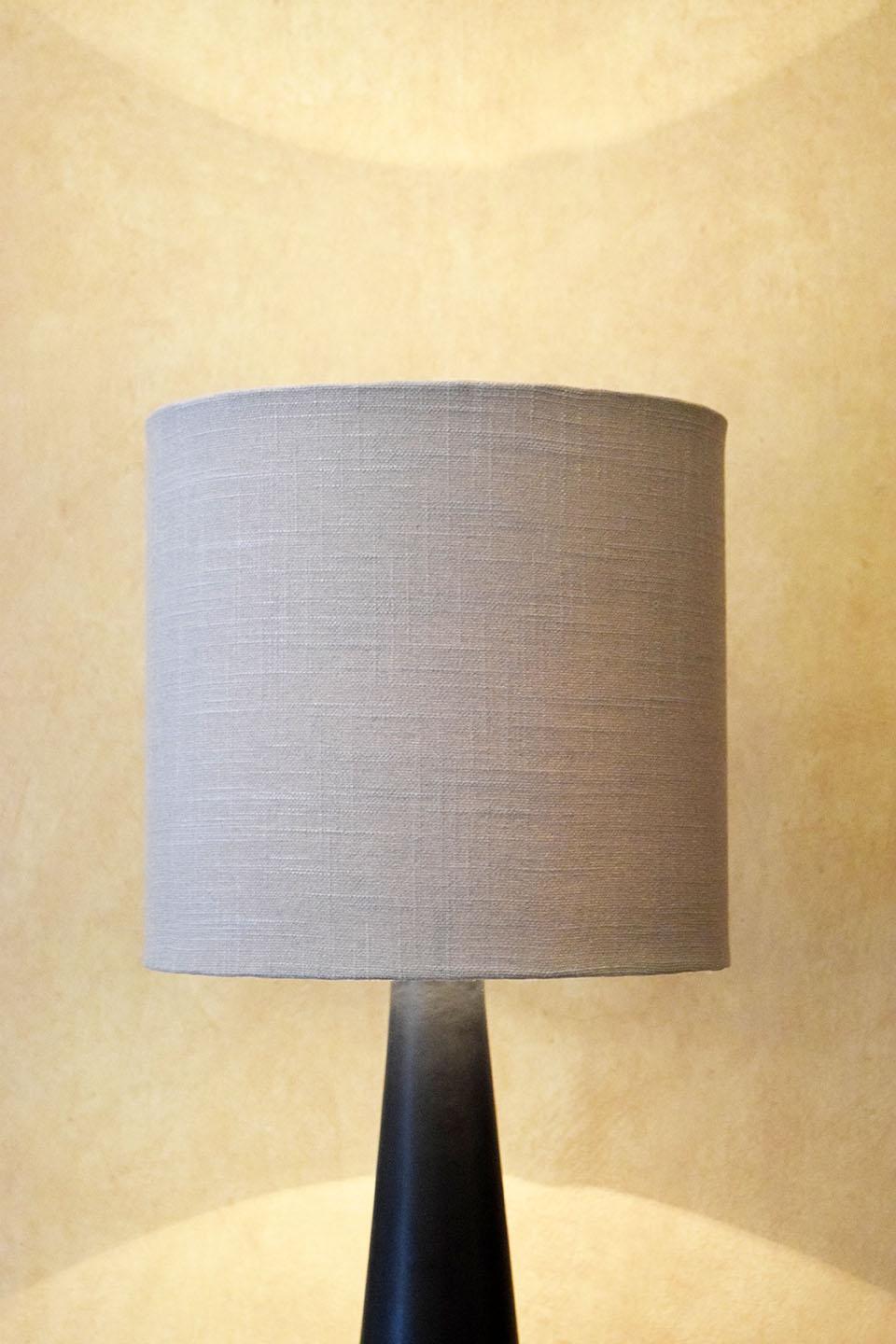 Clean and elegant lines. The base is made of ceramic and the shade is made of linen.
Timeless looks. Warm light.