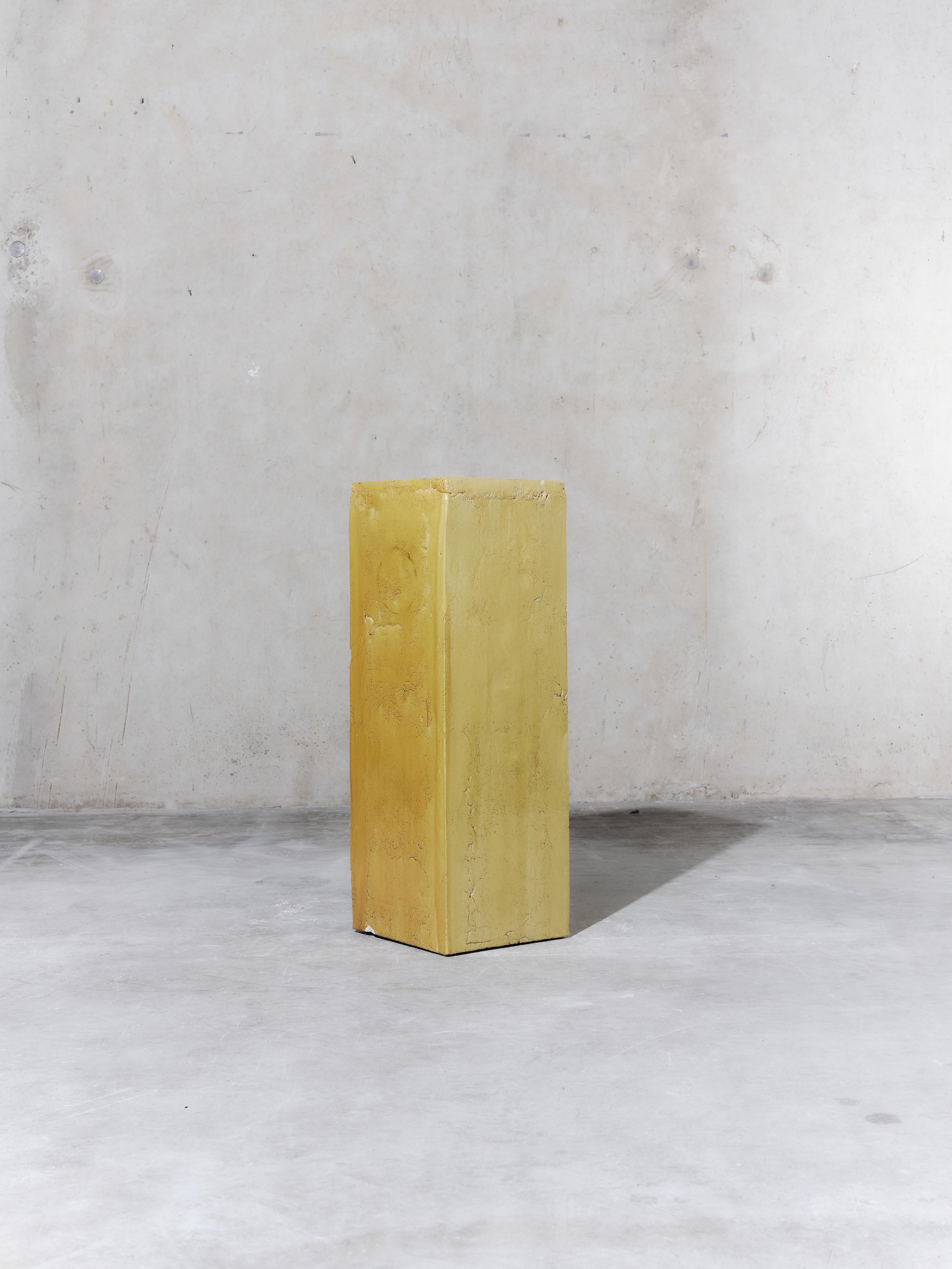 Handmade earthenware side table / pedestal / column manufactured at the workshop of Apparatu in Barcelona. Different clay bodys are mixed with natural fibers like corn, straw, or heather straw. The pieces are casted by hand, creating a thick and