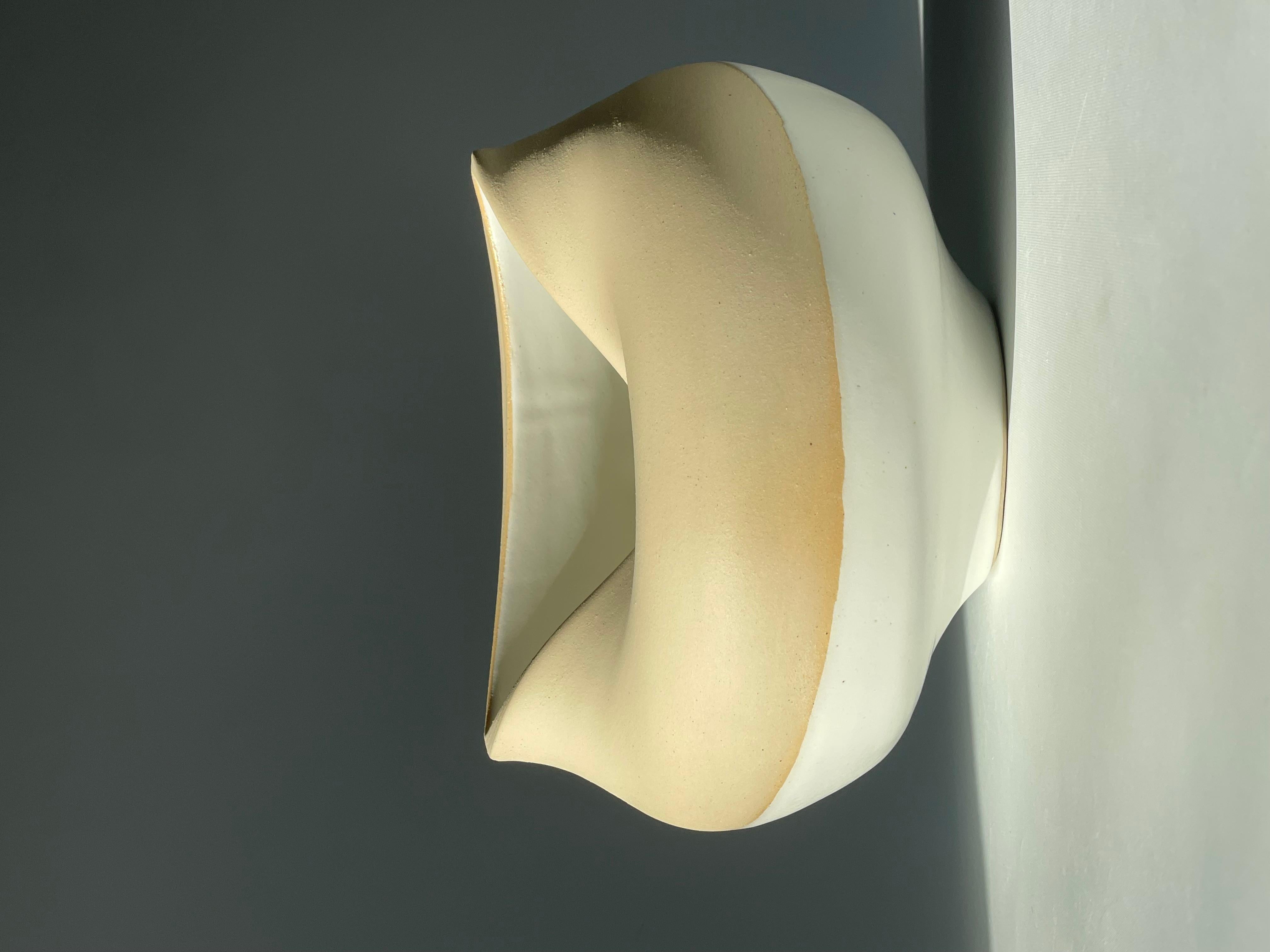 No 48.  Contemporary handmade ceramic natural unglazed two-tone vase with a feature indentation on the rim. Designed and handmade by Brazilian ceramicist Flavio Diogo of FD21 Clay.

Dimensions: Width: 22cm Depth: 19cm Height: 14.5cm Weight: 1.850kg