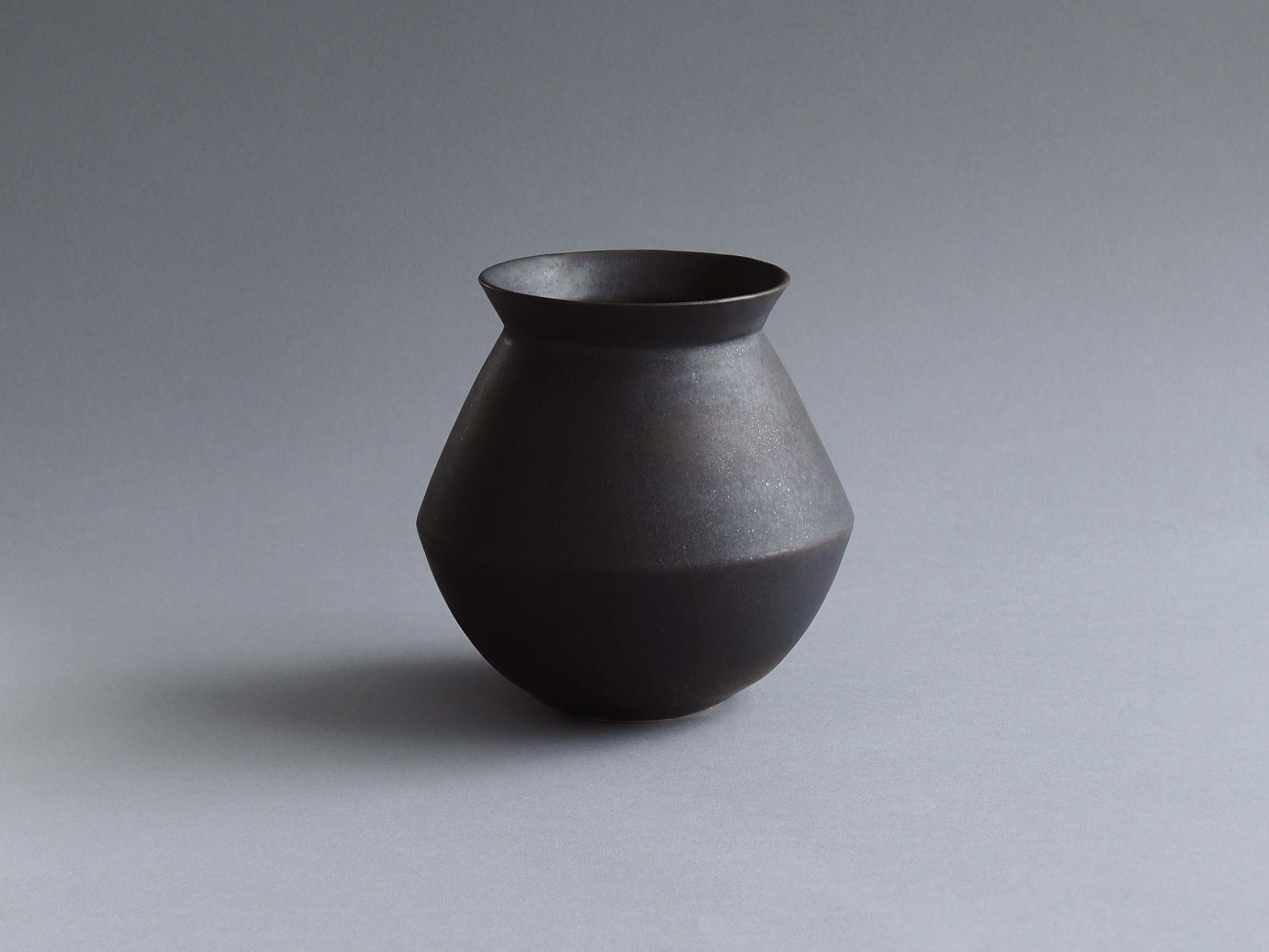 Glazed ceramic vessel by Tracie Hervy. Thrown on the potter’s wheel and fired with a slightly metallic bronze glaze, this one-of-a-kind piece is part of a new body of work created in 2023, inspired by iconic forms in ceramic history.

Tracie Hervy