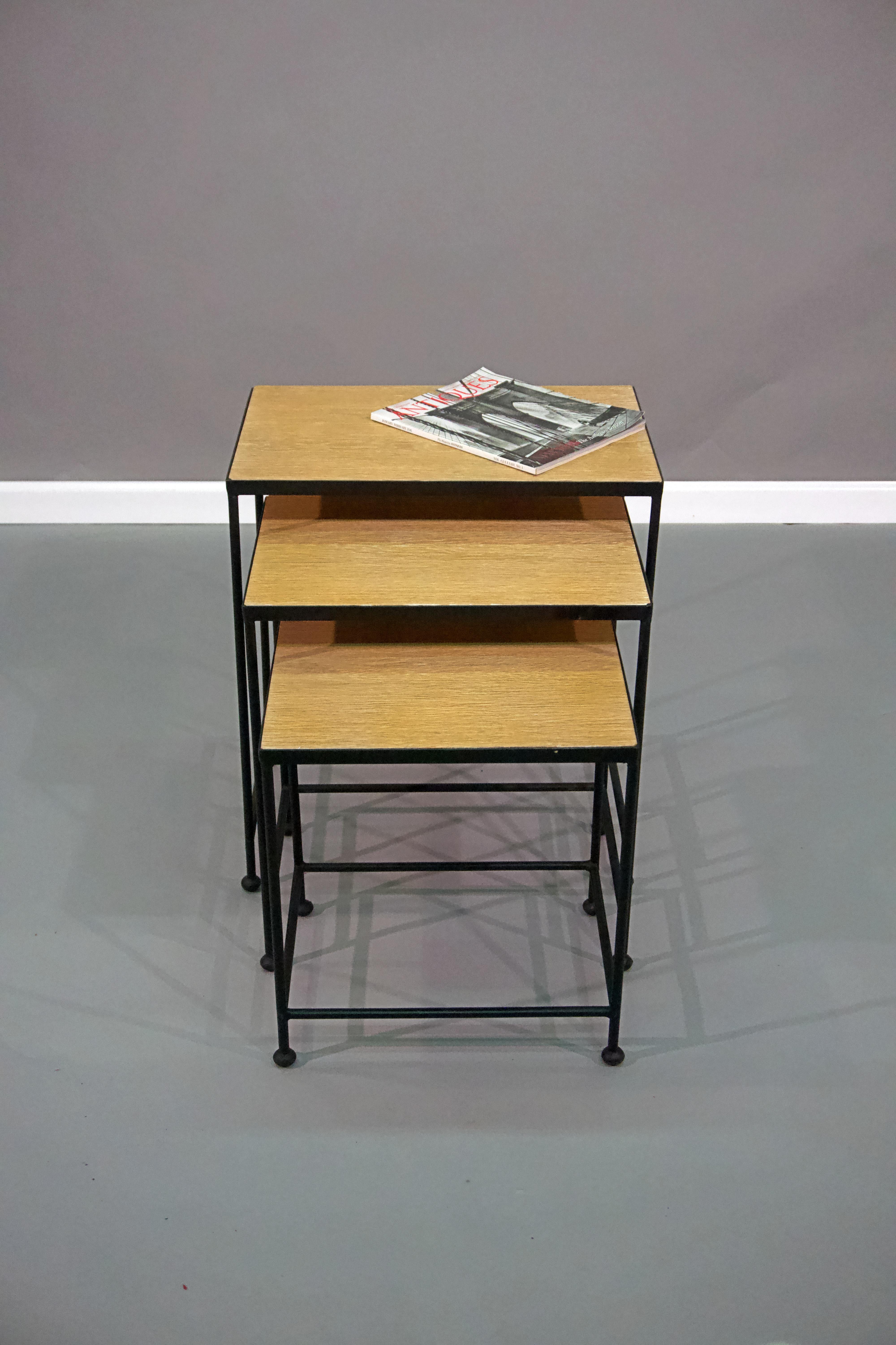 Contemporary cerused oak top nesting tables, with metal frames, circa 1960.