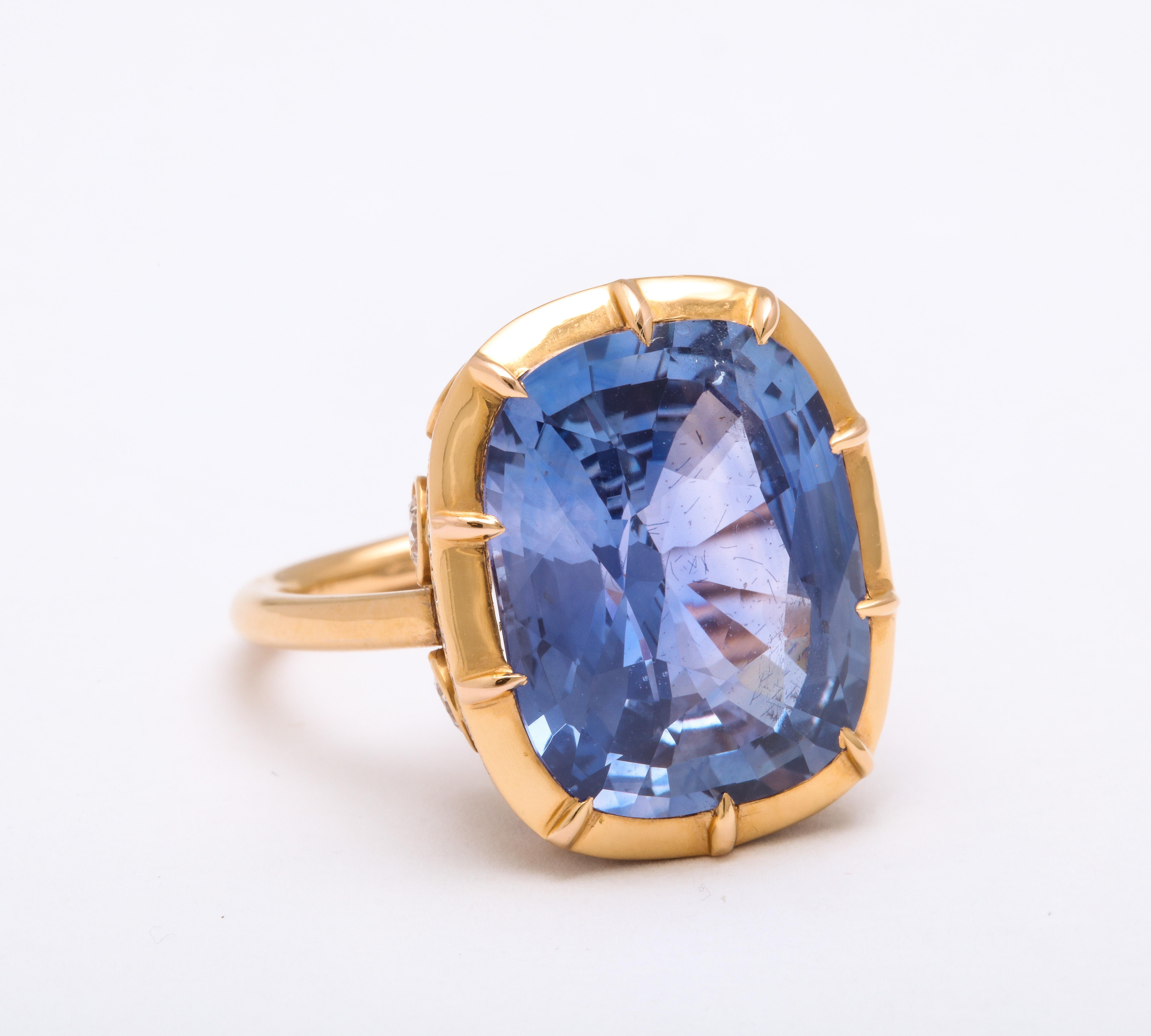 This Contemporary Georgian Ring showcases a cushion cut untreated @15.0 its tw Ceylon Sapphire set in fine white full cut diamonds and yellow gold.

Materials:
7.4 dwt
18K yellow gold 

Stones:
Ceylon Sapphire Cushion cut untreated @15.0 its tw
Fine