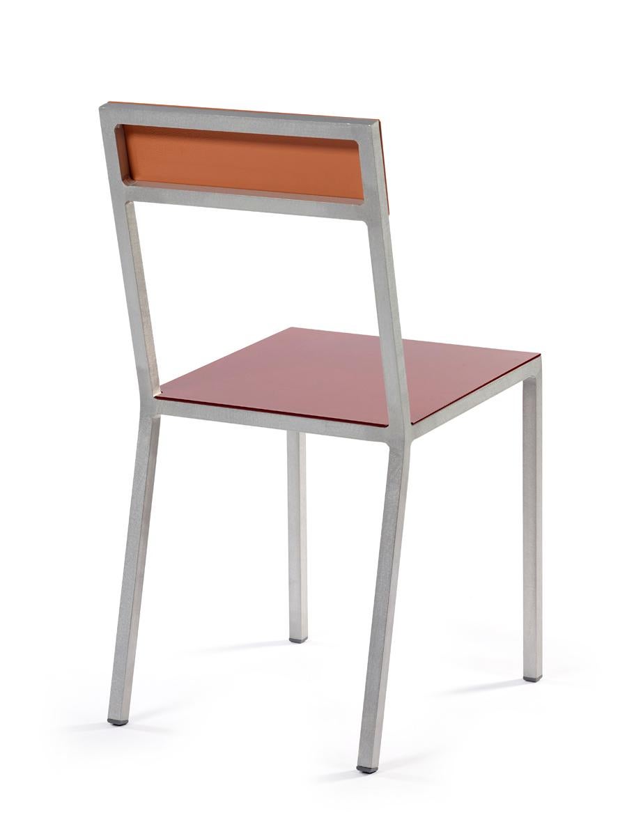 ALU contemporary chair
by muller van severen

Code: V9016035F
Model: aluminium frame, seat burgundy, pink red 

This time Fien Muller and Hannes Van Severen revamped their classic Alu Chair by interchanging the aluminium back and seat with a wooden