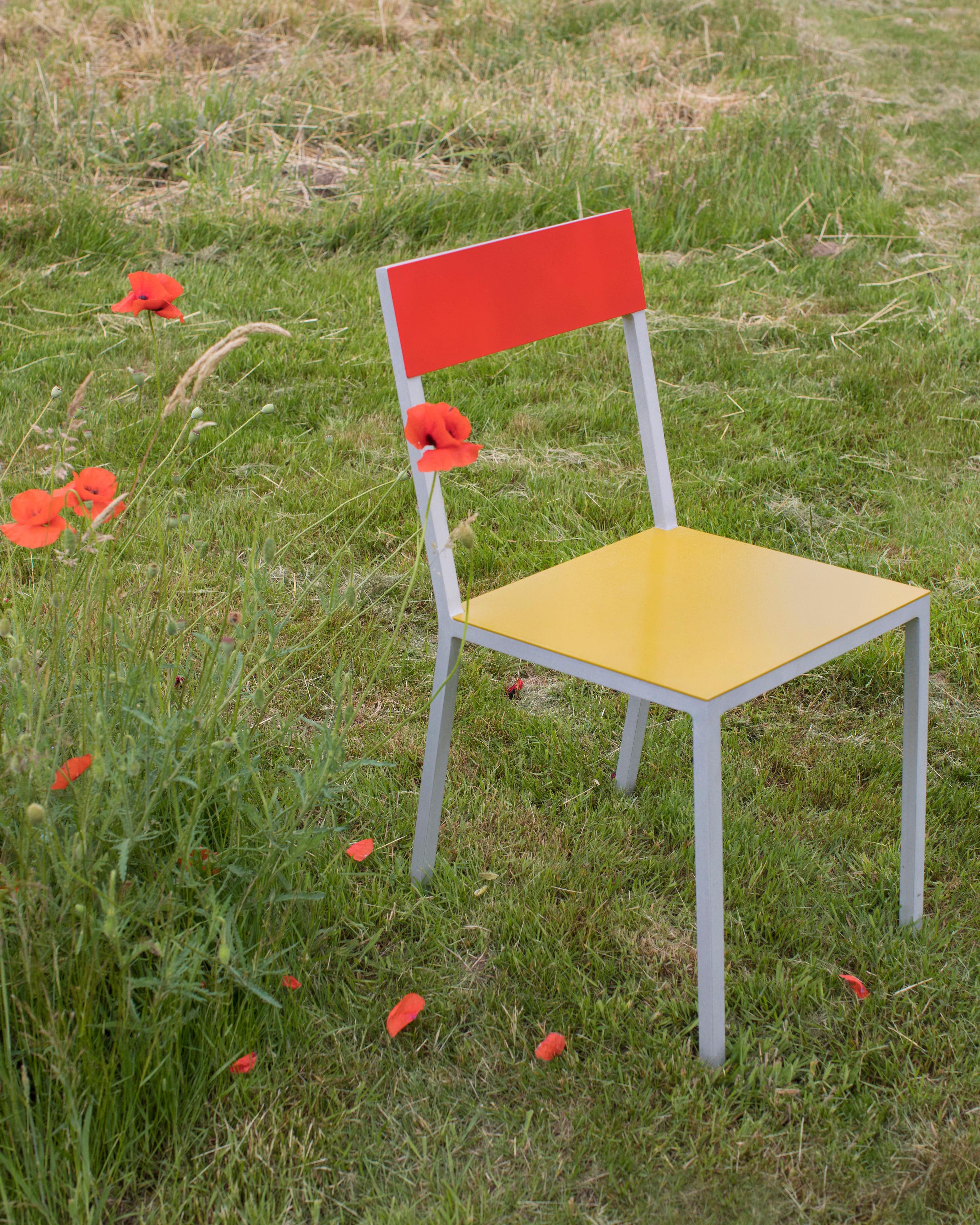 ALU contemporary chair
by muller van severen

Code: V9016035E
Model: aluminium frame, seat curry, back red 

This time Fien Muller and Hannes Van Severen revamped their classic Alu Chair by interchanging the aluminium back and seat with a wooden