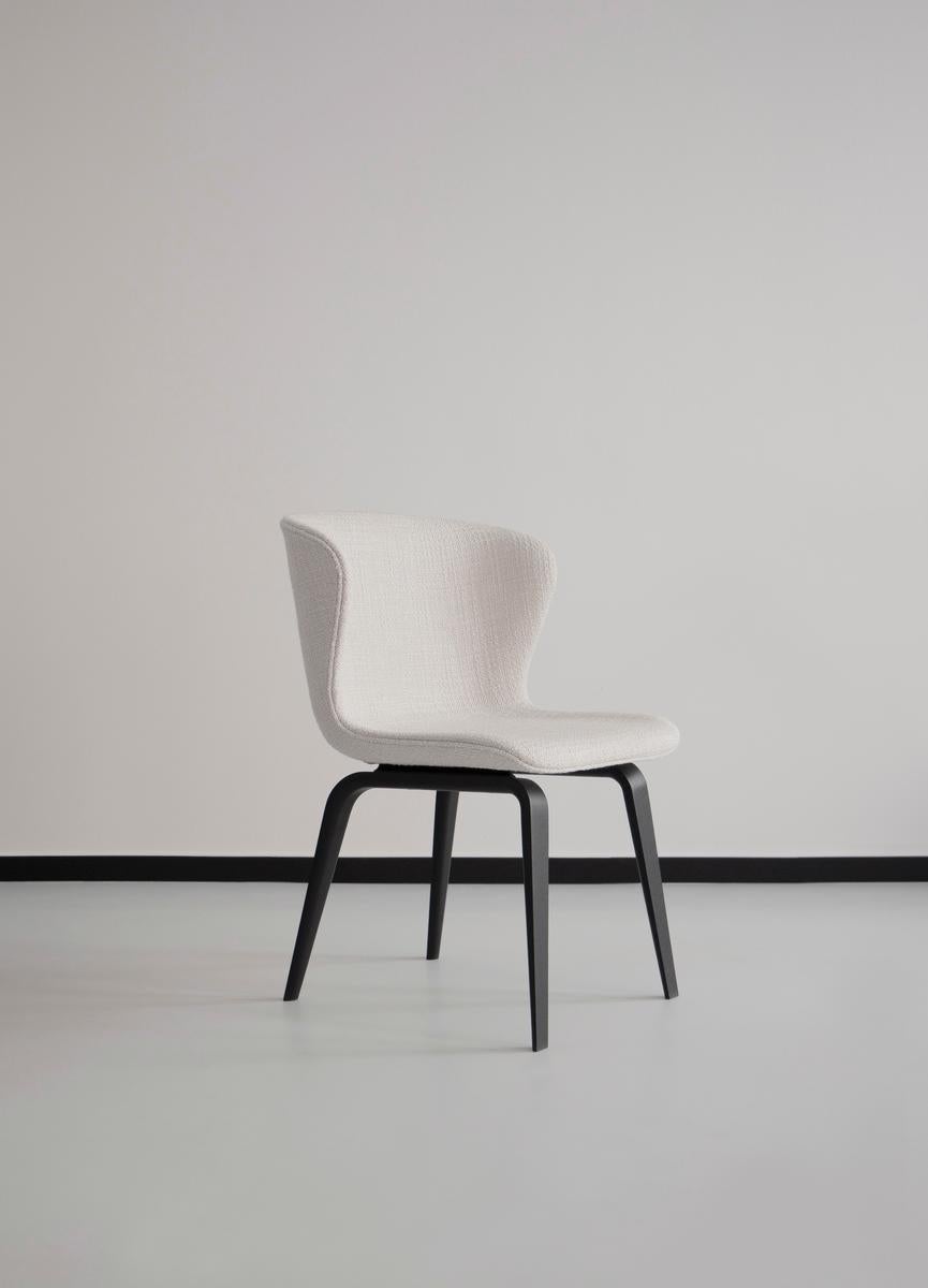 Pipe Wood Chair 
Design: Friends & Founders

Upholstery available in a wide range of fabrics and leathers
Legs available in: black or smoked wood
Model shown (fabric): Kirkby, Loop Cream (Bouclé)

Price may vary depending on the fabric and
