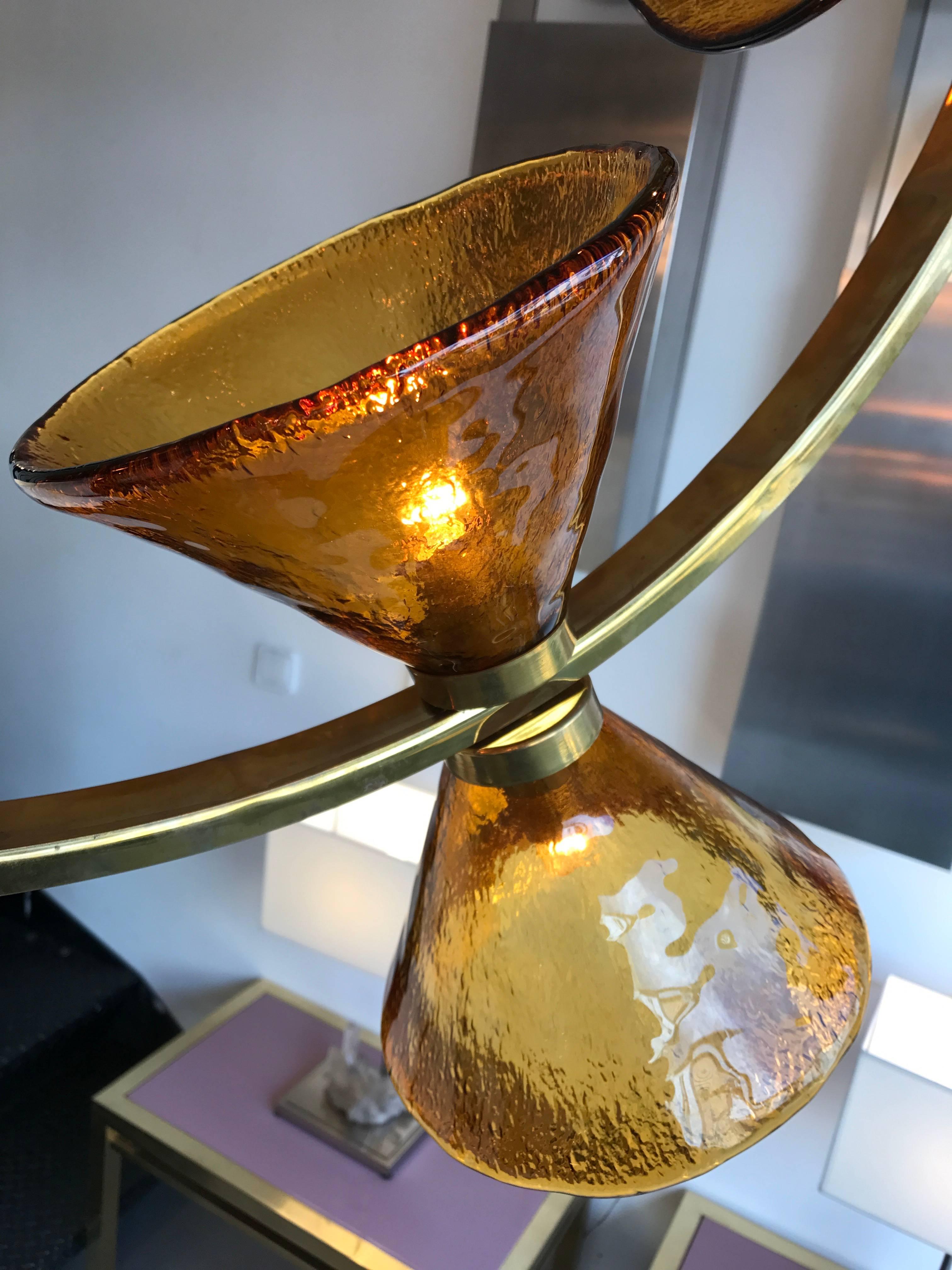 Chandelier or ceiling pendant light, circle brass and diabolo blown amber Murano glass cone. In the style of Mazzega, Leucos, Venini, Vistosi, Hollywood Regency, Carlo Nason, Poliarte. Very impressive and decorative.