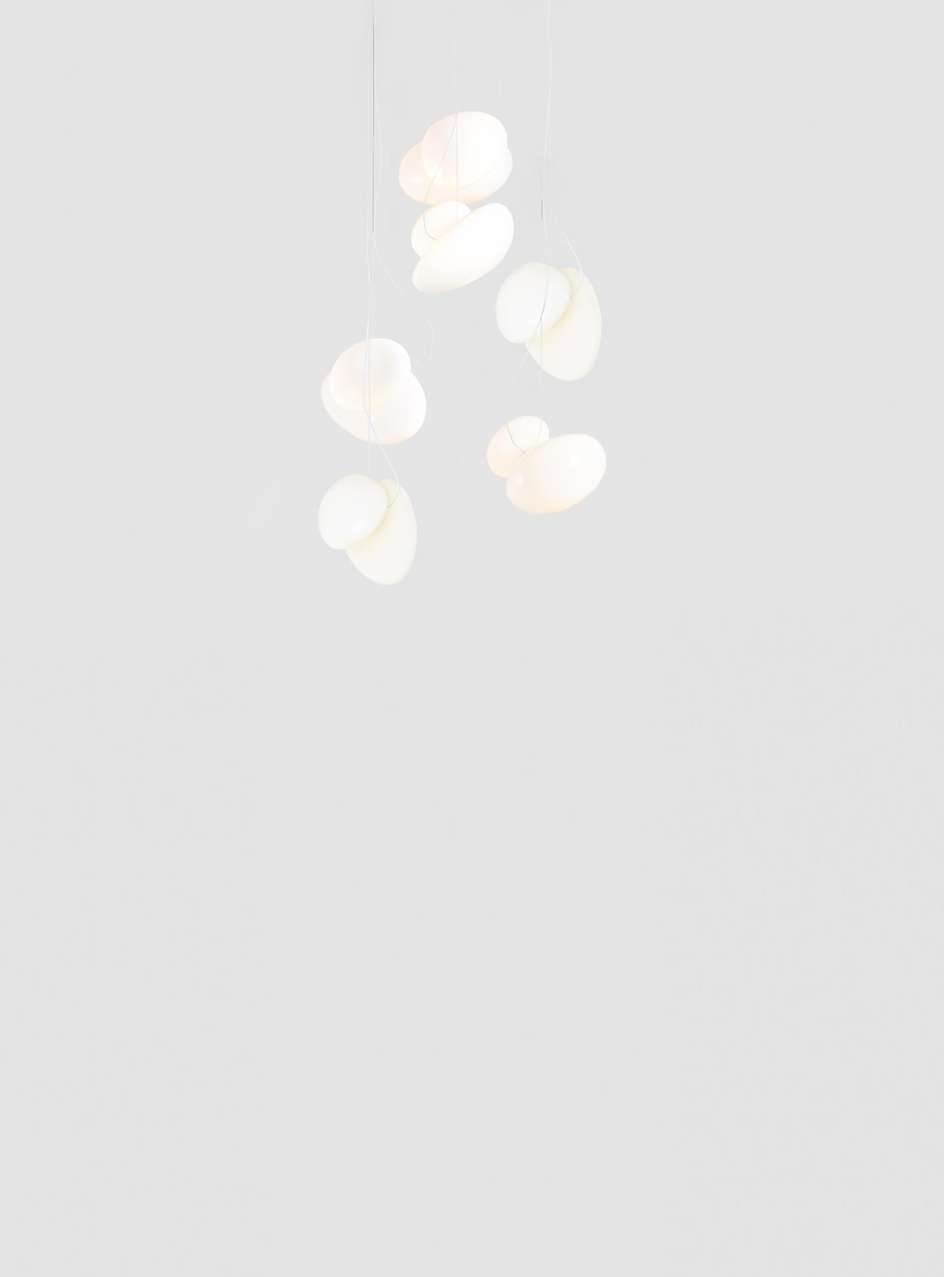 Contemporary chandelier Pebble 
Drop type: Double Helix 

Electrical : 
Voltage: 110 – 277V / 220 – 240V
Integral LED source : 3 x 14W LED 39V

The model shown in picture:
Each pendant: Ø 35cm, 5kg
Canopy: Ø 69cm, 11kg
Color: White