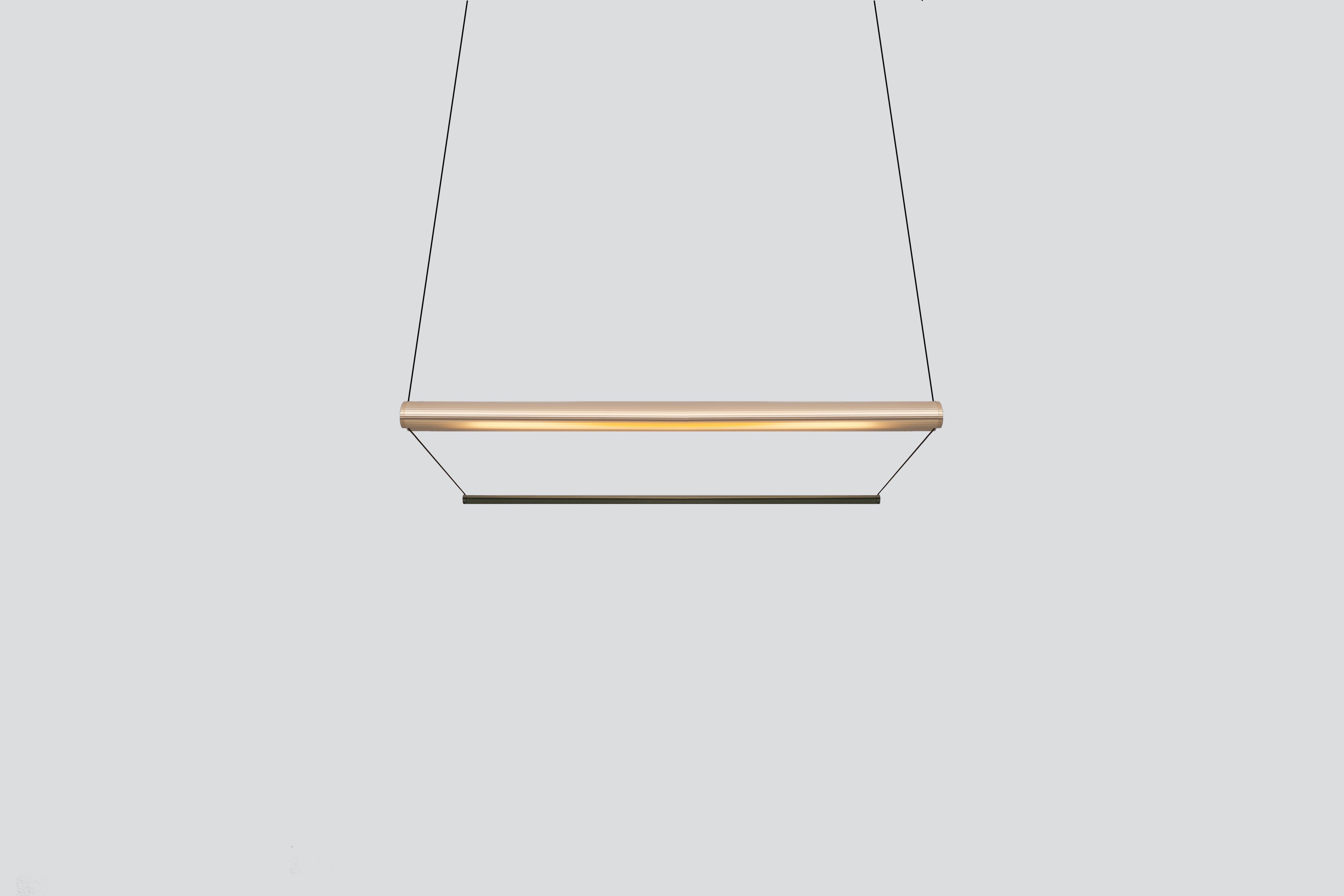 Contemporary Chandelier / Pendant Lamp 'Tier 100-P', Gold and Emerald by AND
Designer: Lukas Peet

Materials:
– Aluminum

Dimensions:
- 100cm x 20cm x 17.5cm
39.25” x 7.75” x 7”
- Adjustable drop length: 243cm / 96”

Input Voltage:
- 110–120V,
