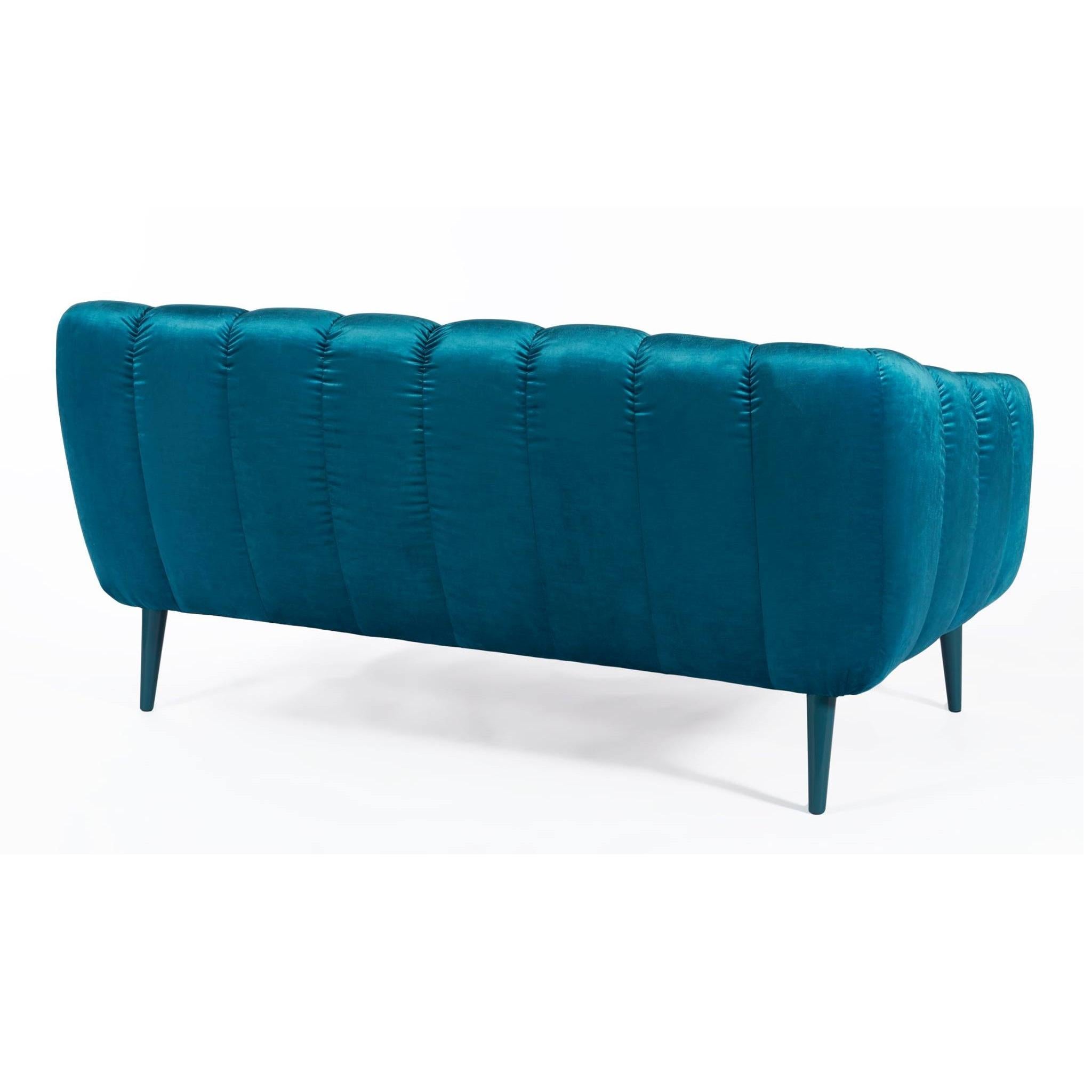 Designed with a thorough but playful attention to geometry and form, this sofa has a glamorous 60’s & 70’s sci-fi retro look. Its quilted upholstery is reminiscent of the midcentury aesthetic, with proportions suited for contemporary living