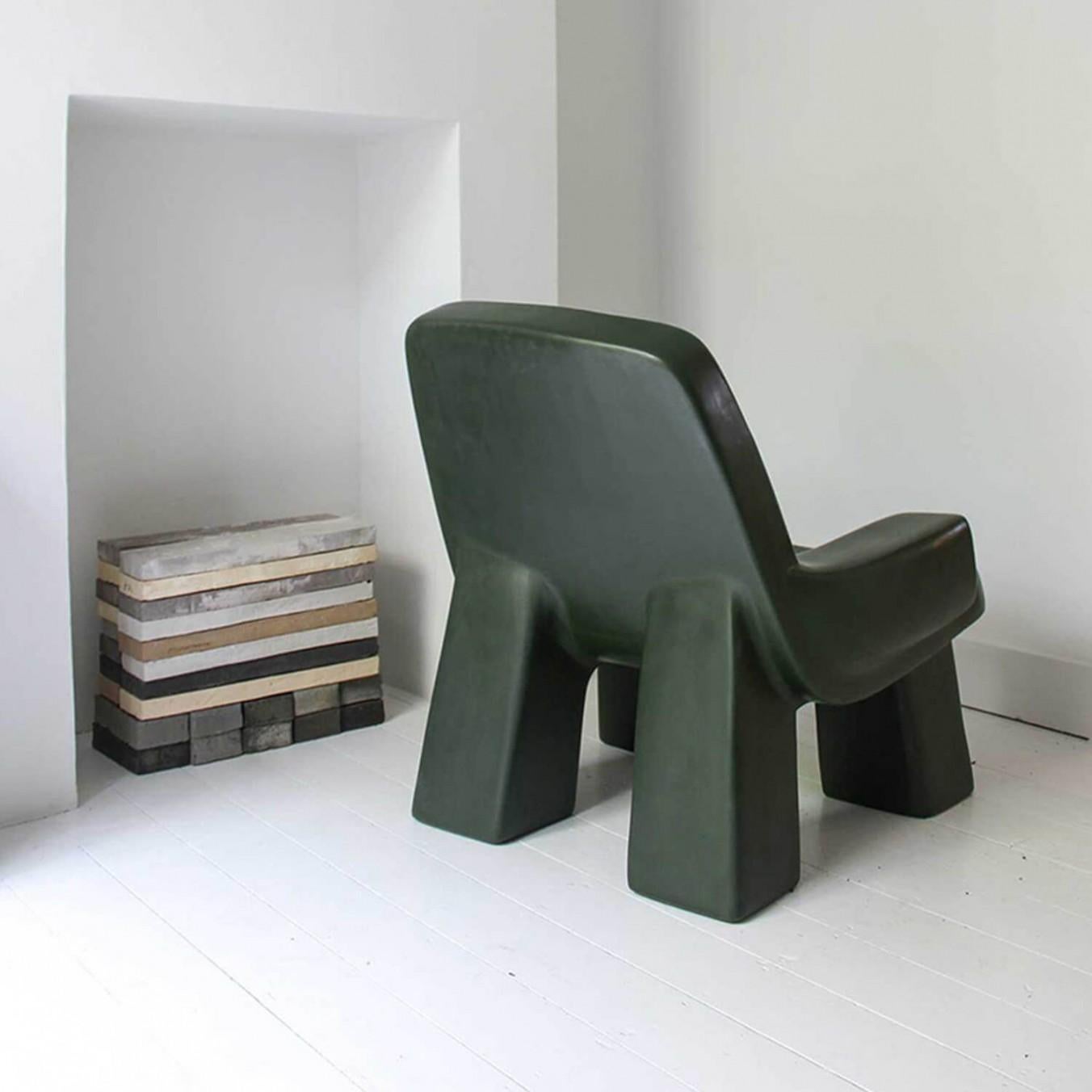 Contemporary fiberglass armchair - Fudge Chair by Faye Toogood. This is shown in the charcoal opaque fiberglass finish. 
Design: Faye Toogood
Material: fiberglass 
Available also in cream, malachite or mallow opaque finish.

Faye Toogood’s new