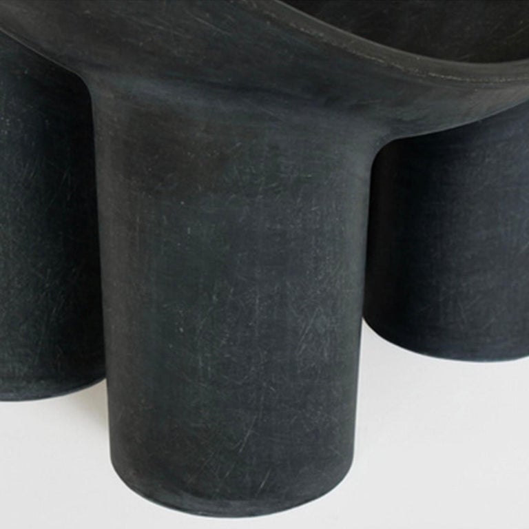 Contemporary fiberglass chair - Roly Poly Chair by Faye Toogood. This is shown in the charcoal fiberglass finish. 
Design: Faye Toogood
Material: Fiberglass 
Available also in cream or raw finish, please contact us.

The Roly Poly chair is the