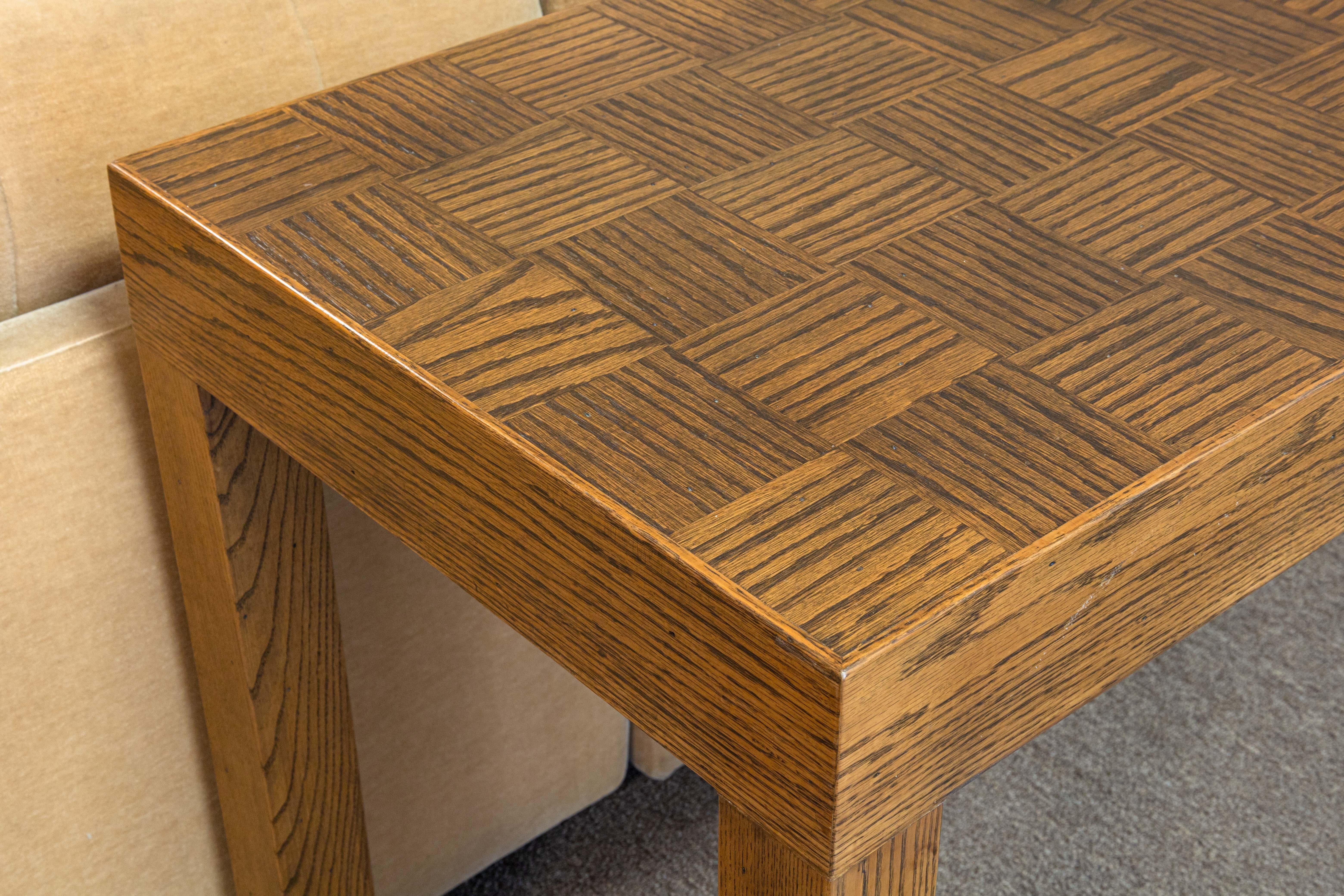 A contemporary wood console table. This is a beautiful handcrafted console table. This piece is designed with lovely pieces of wood, boasting a checkered zebra wood grain table top, and four solid wood legs with wonderful grain. This piece is simple