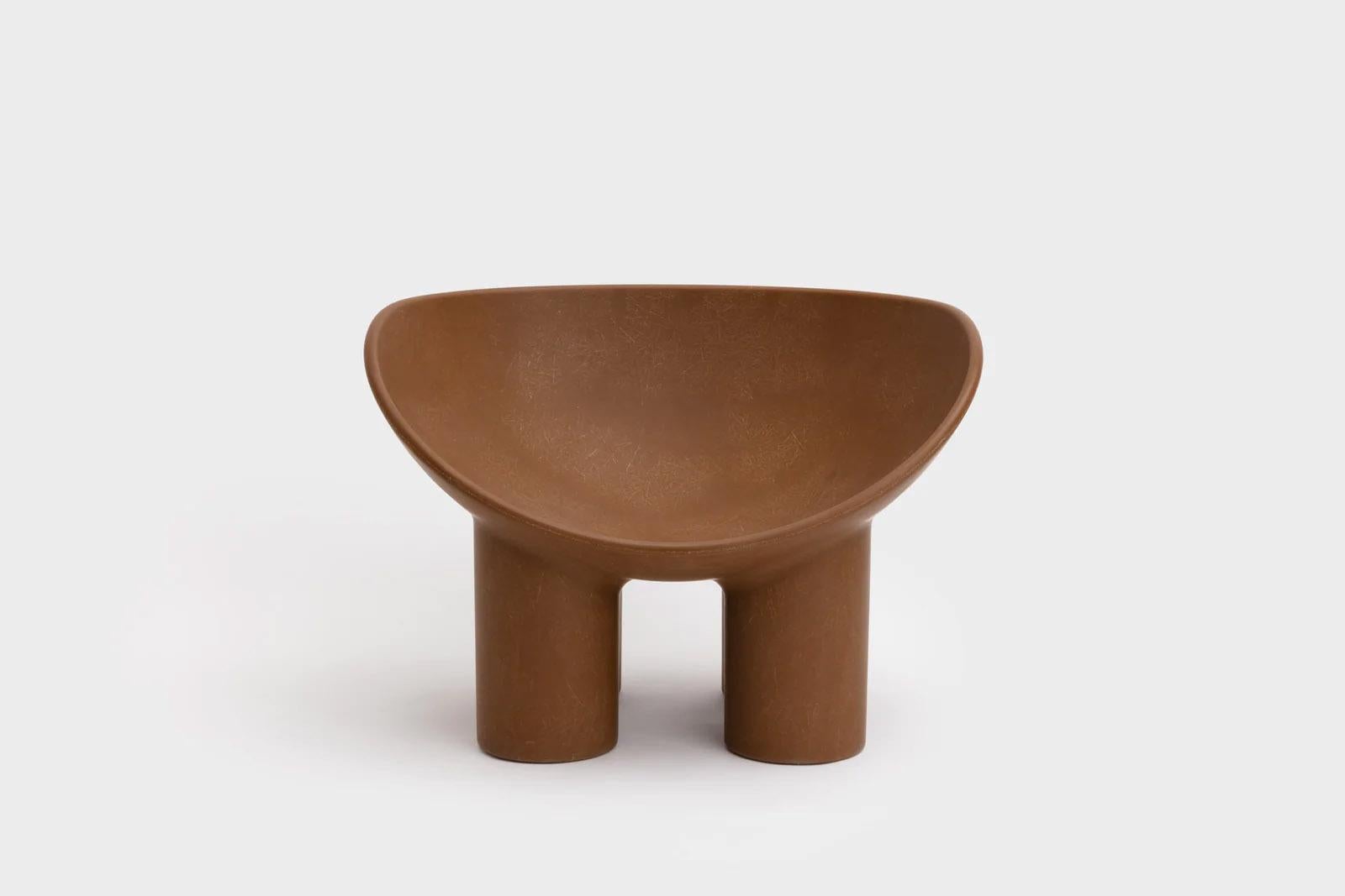 Contemporary fiberglass chair - Roly Poly chair by Faye Toogood. This is shown in the chestnut fiberglass finish. 
Design: Faye Toogood
Material: Fiberglass 
Available also in raw, cream or charcoal finish

The Roly Poly chair is the anchor piece of