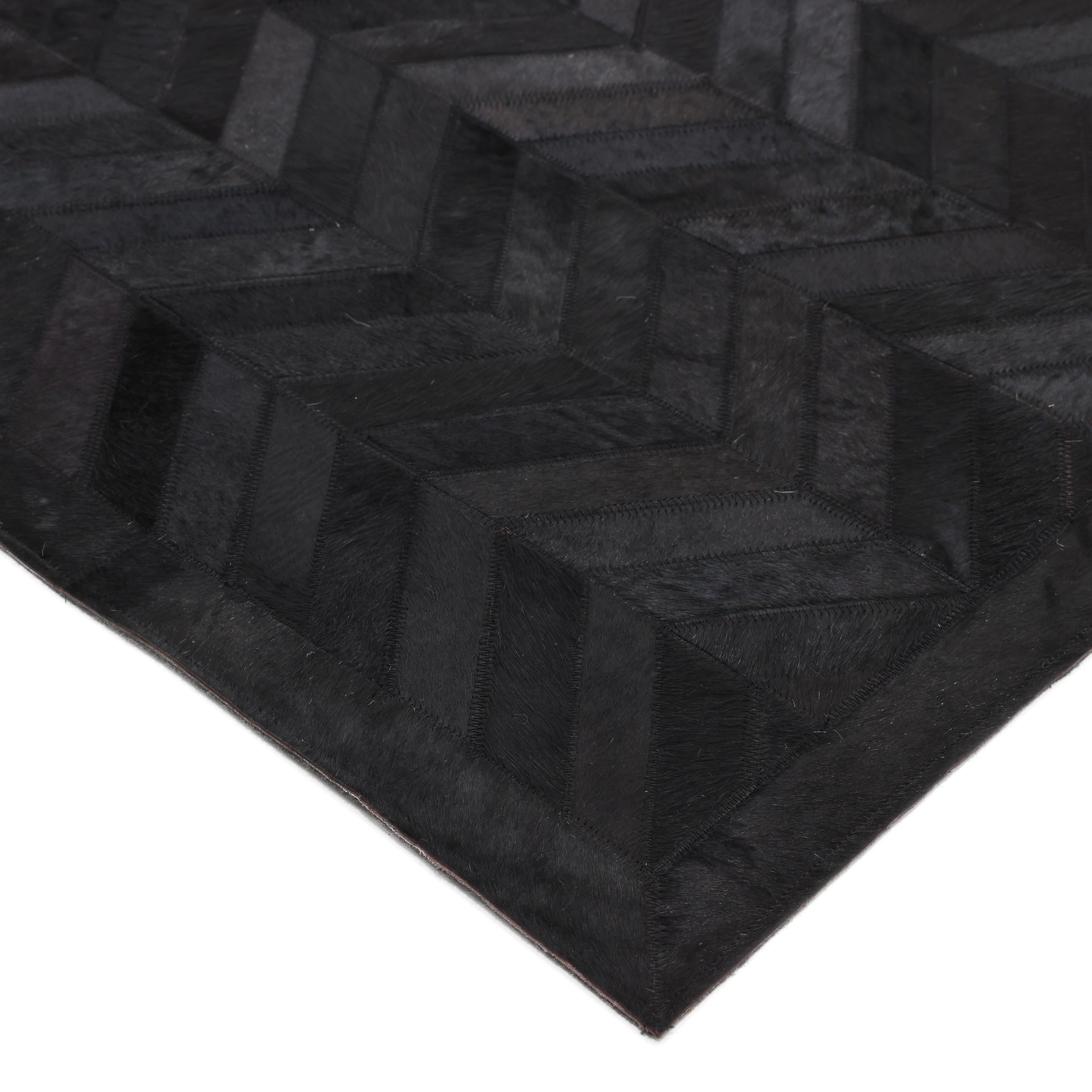 The Cowhide collection shows how urbane “rustic” 100%-natural hair-on hides can be. The natural variations of the hides add warmth and depth to the geometric motifs and give each rug a beauty of its own. The rugs include felt backing for extra