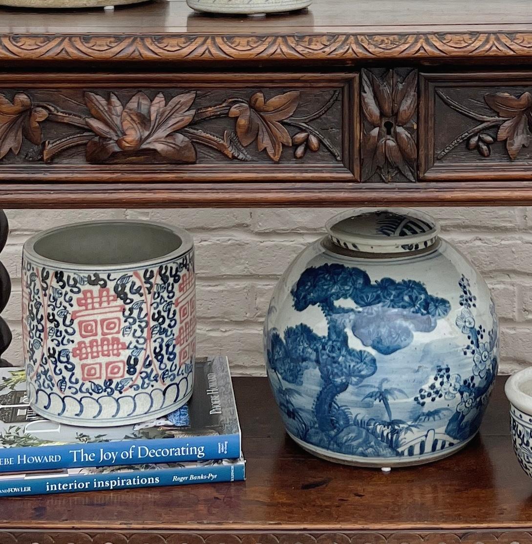 Handmade blue and white porcelain large lidded ginger jar with an antique finish. Inspired by the pottery of ancient Chinese empires, this jar will make a dramatic feature when displayed as a centerpiece or on a console table. Painted with bold,
