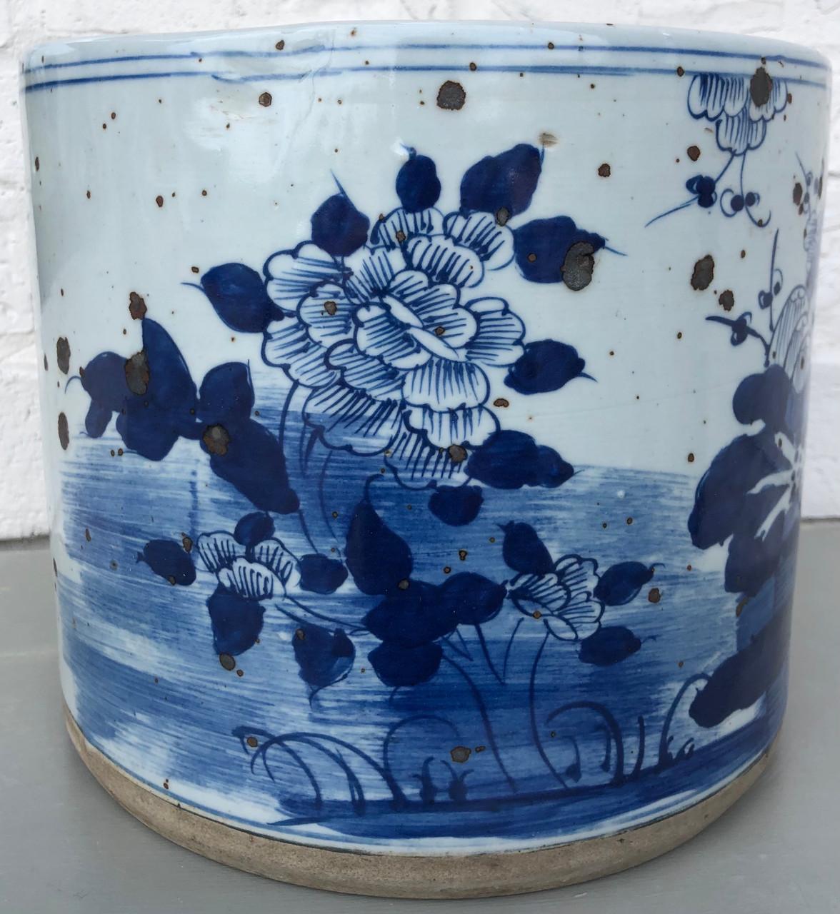 Handmade blue and white porcelain planter with an antiqued finish. This planter is hand-painted with lots of flourishing flowers and branches. Add a fern for a burst of beautiful color or gorgeous hydrangeas for everyday charm.

Dimensions: 9.5