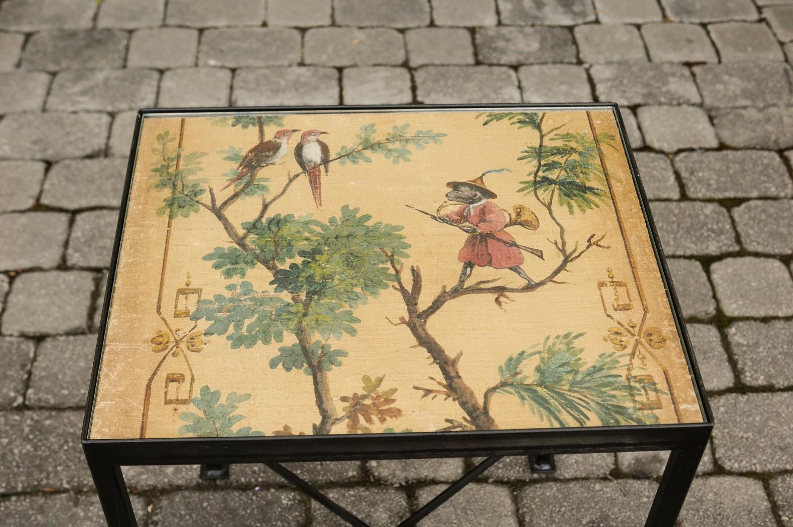 A contemporary chinoiserie style side table made from an antique 1870s screen depicting a monkey and two birds, mounted on a custom iron stand. We currently have four tables available of two slightly different dimensions available. This stylish