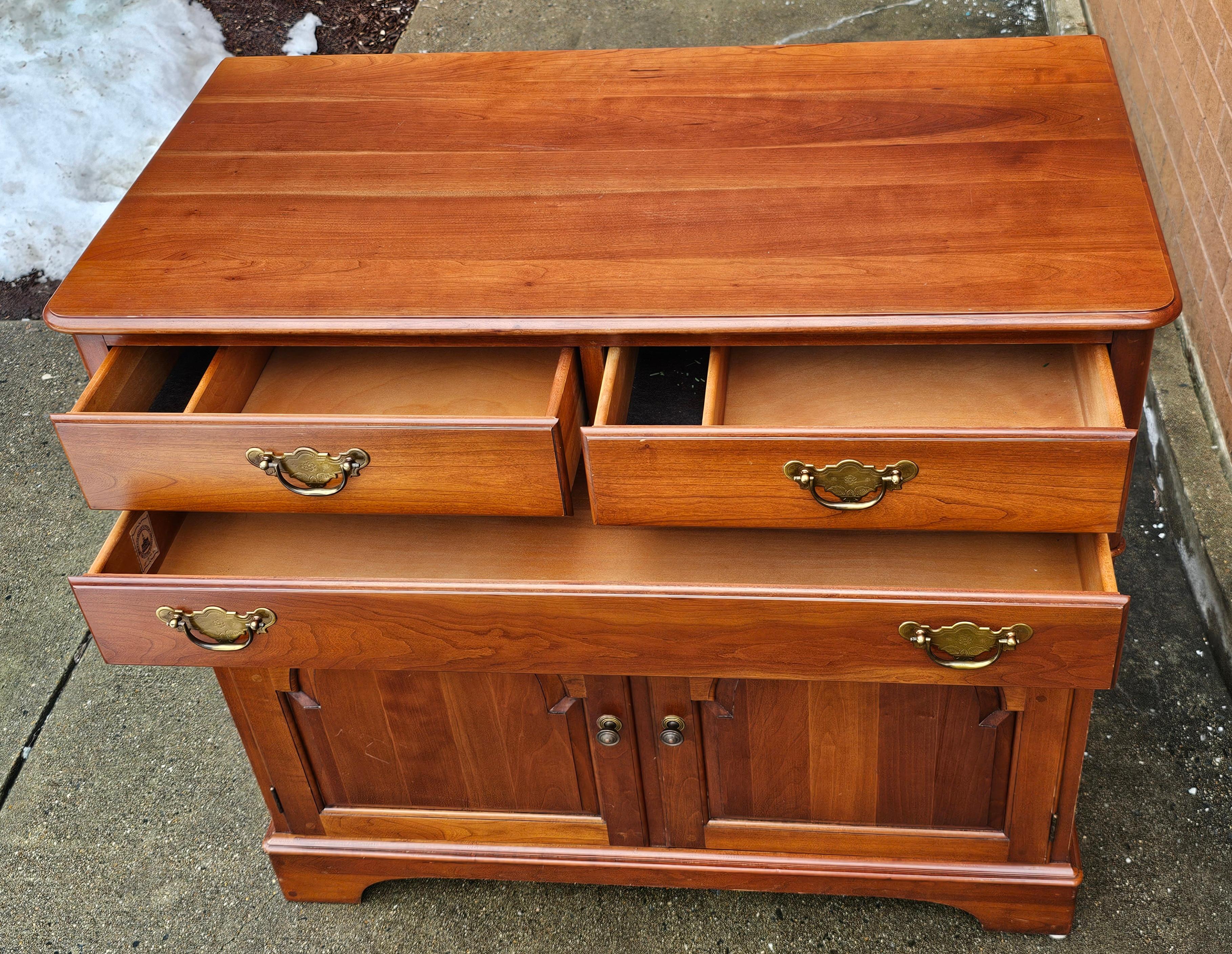 A Pennsylvania House Contemporary Chippendale Style Side Cabinet Buffet featuring rare 3 drawer and large double french  door storage cabinet. Meaures 38
