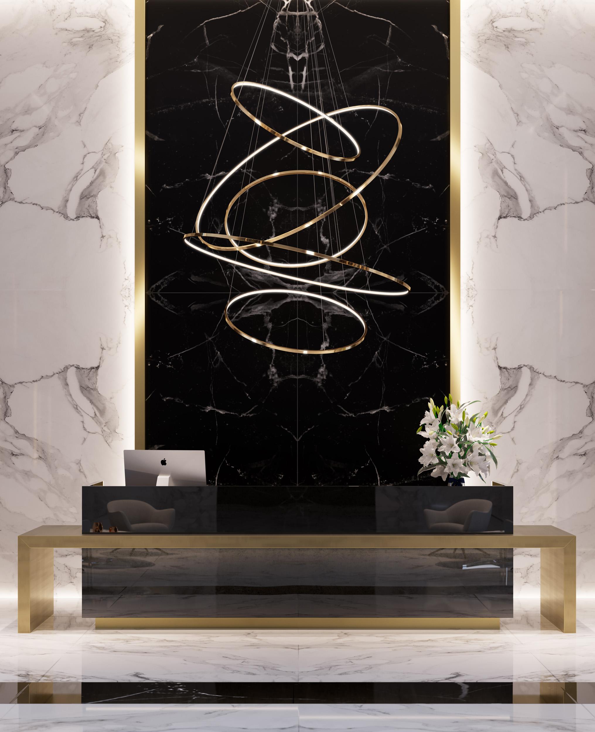 Contemporary circular medium Lohja LED five-ring chandelier in polished brass.

This contemporary chandelier is inspired by the tranquil lakes of Lohja, Finland, to explore peace, breath and balance. The Lohja brings clarity to high-ceiling rooms,