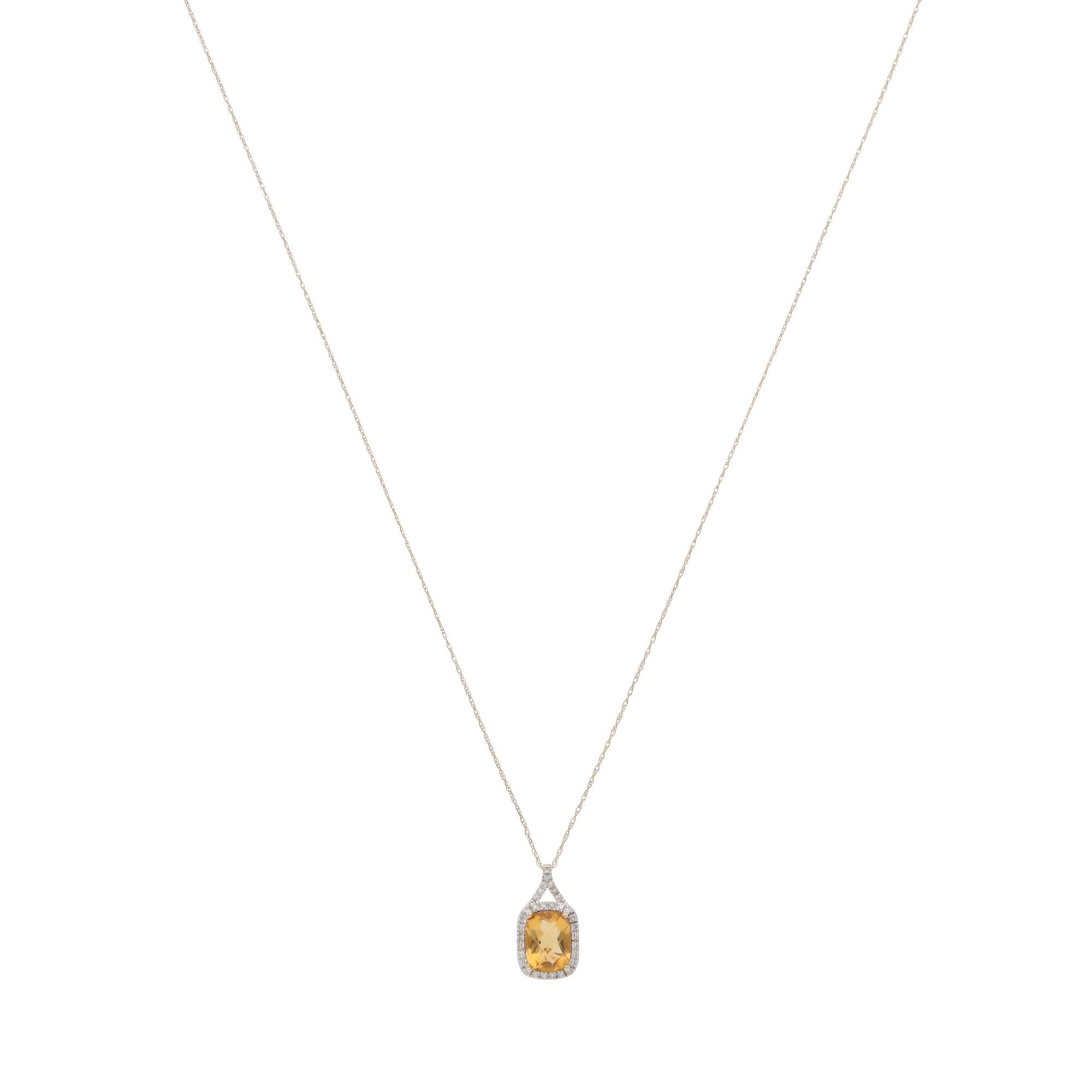 A beautiful contemporary citrine and diamond cluster pendant necklace set in 14k yellow gold.

The pendant is predominately prong-set with a cushion-cut citrine, surrounded by 32 round brilliant-cut diamonds. The diamonds are set in micro-claw