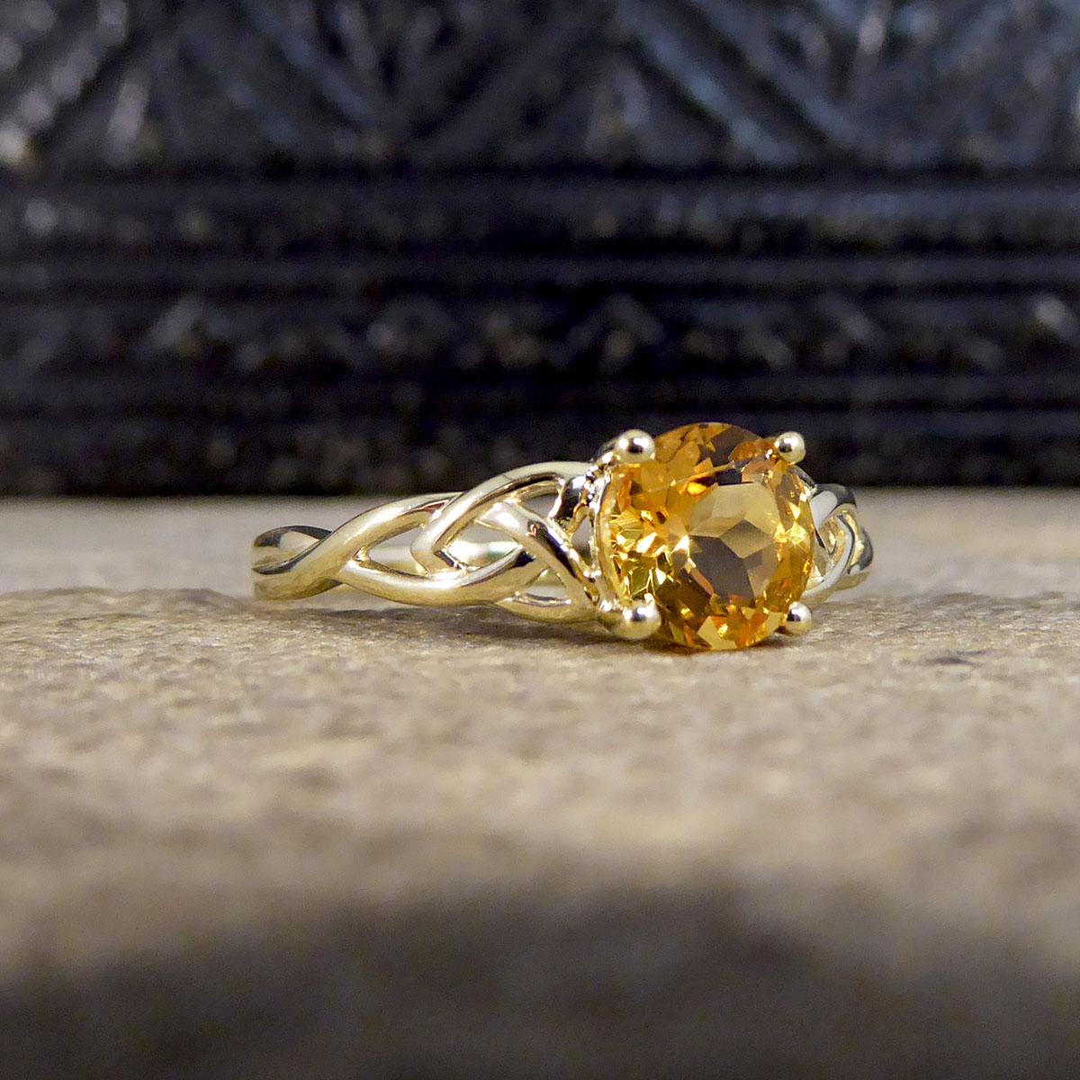 This lovely Contemporary ring has been crafted with a beautifully detailed shoulder leading down to the band that is all crafted in 9ct Yellow Gold. It features a Round cut Citrine in the centre, and is the perfect simple yet beautiful style.

Ring