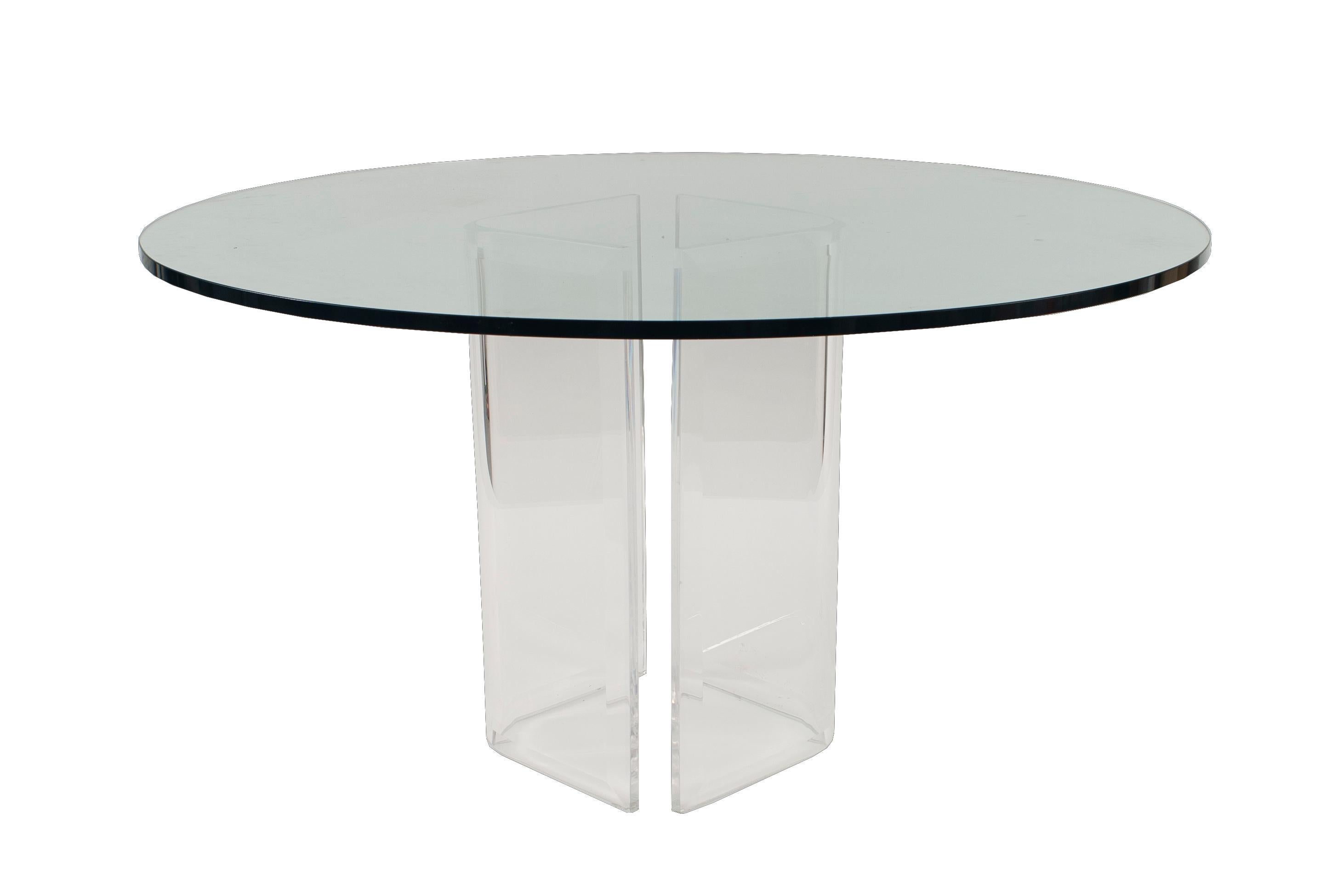 Contemporary center/dining table with a circular clear glass top on a clear 2-part movable lucite pedestal base

Condition: Good; Wear consistent with age and use