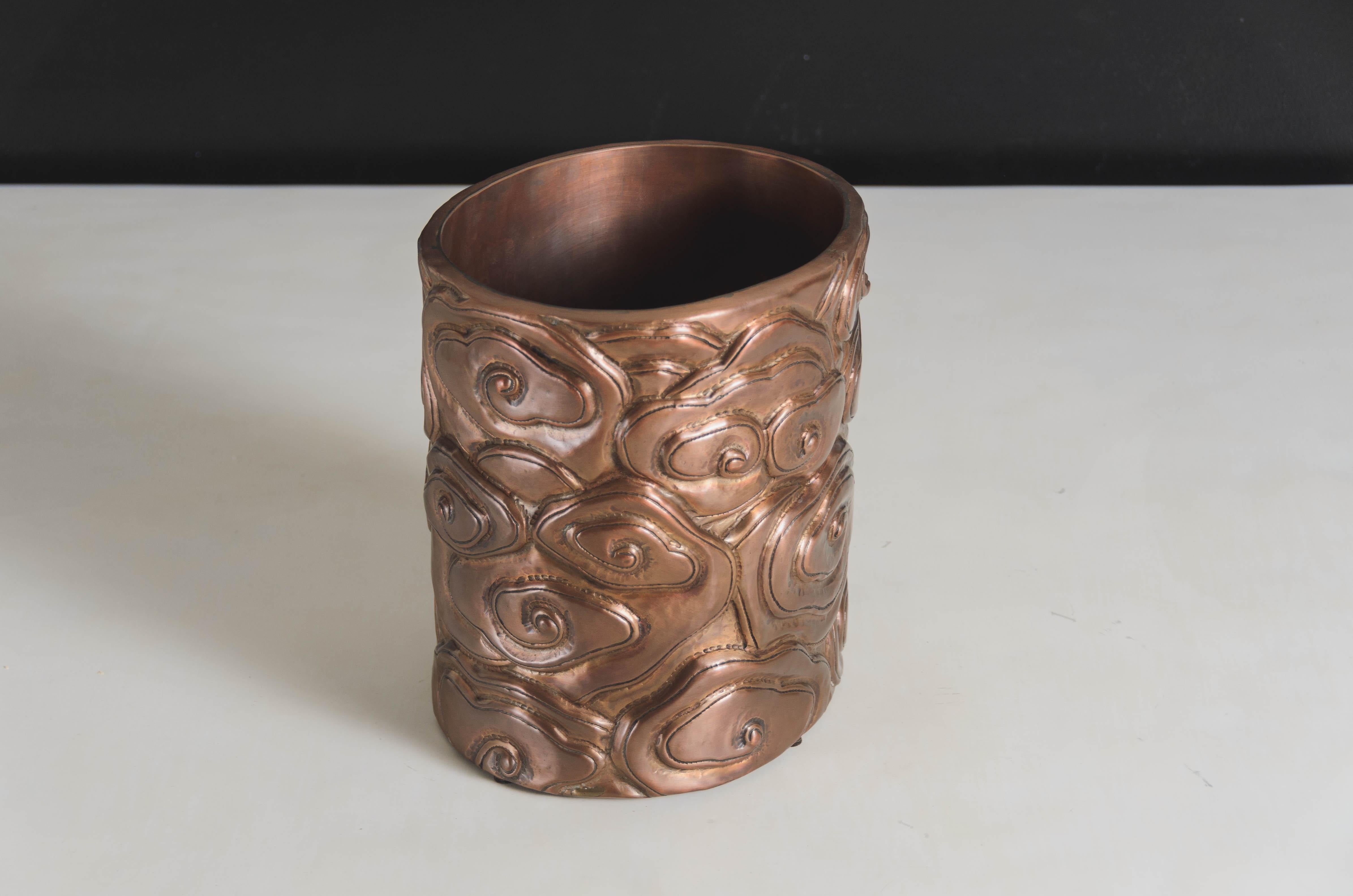 Cloud design brushpot
Antique copper
Hand repoussé
Limited edition
Repoussé is the traditional art of hand-hammering decorative relief onto sheet metal. The technique originated around 800 BC between Asia and Europe and in Chinese historical