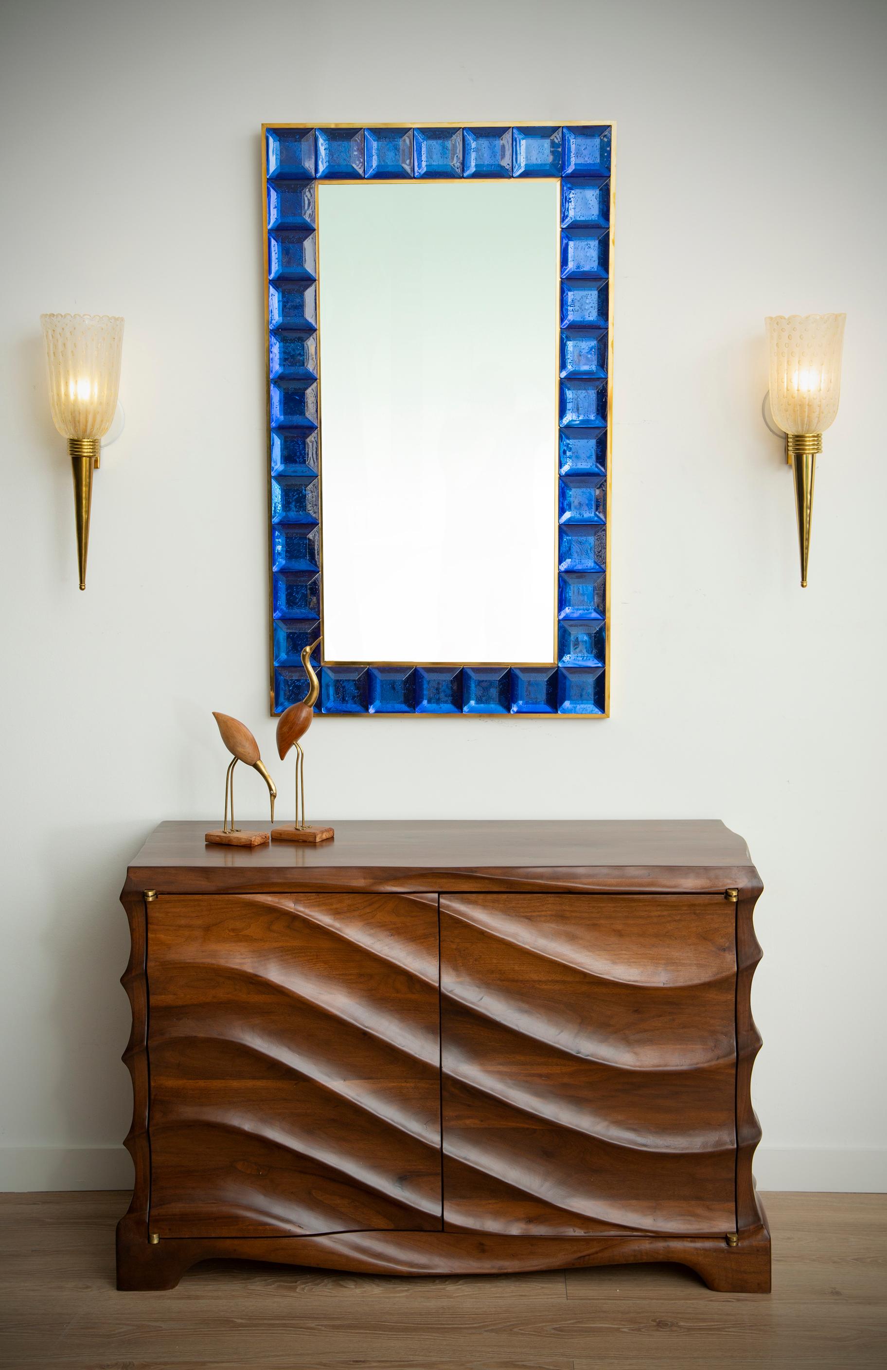 Contemporary cobalt blue square diamond cut Murano glass mirror (2 available), in stock
Vivid and intense cobalt blue glass block with naturally occurring air inclusions throughout 
 Highly polished faceted pattern
 Brass gallery
 Luxury