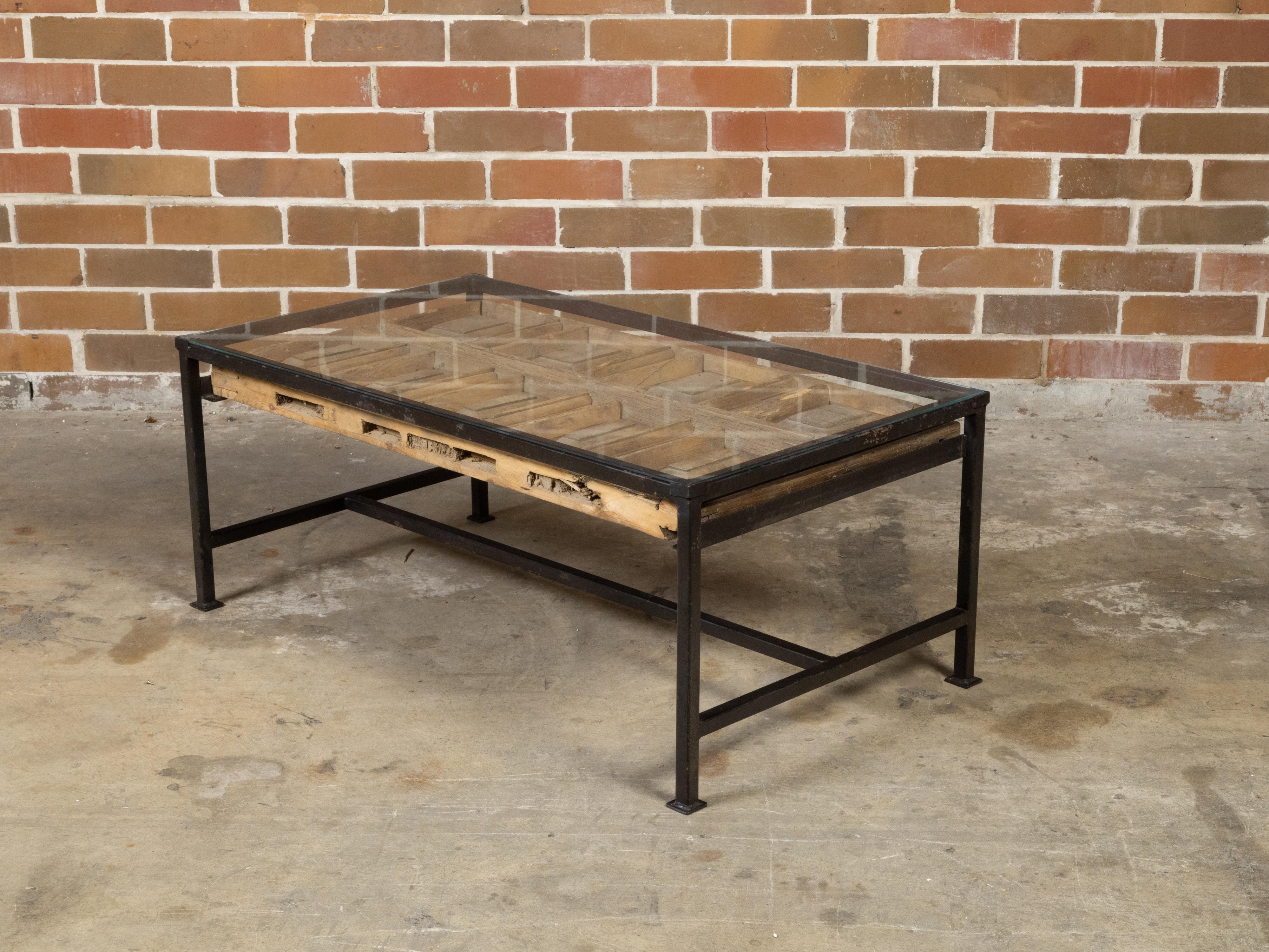 Carved Contemporary Coffee Table Made with Antique Door Fragment on Custom Iron Base For Sale