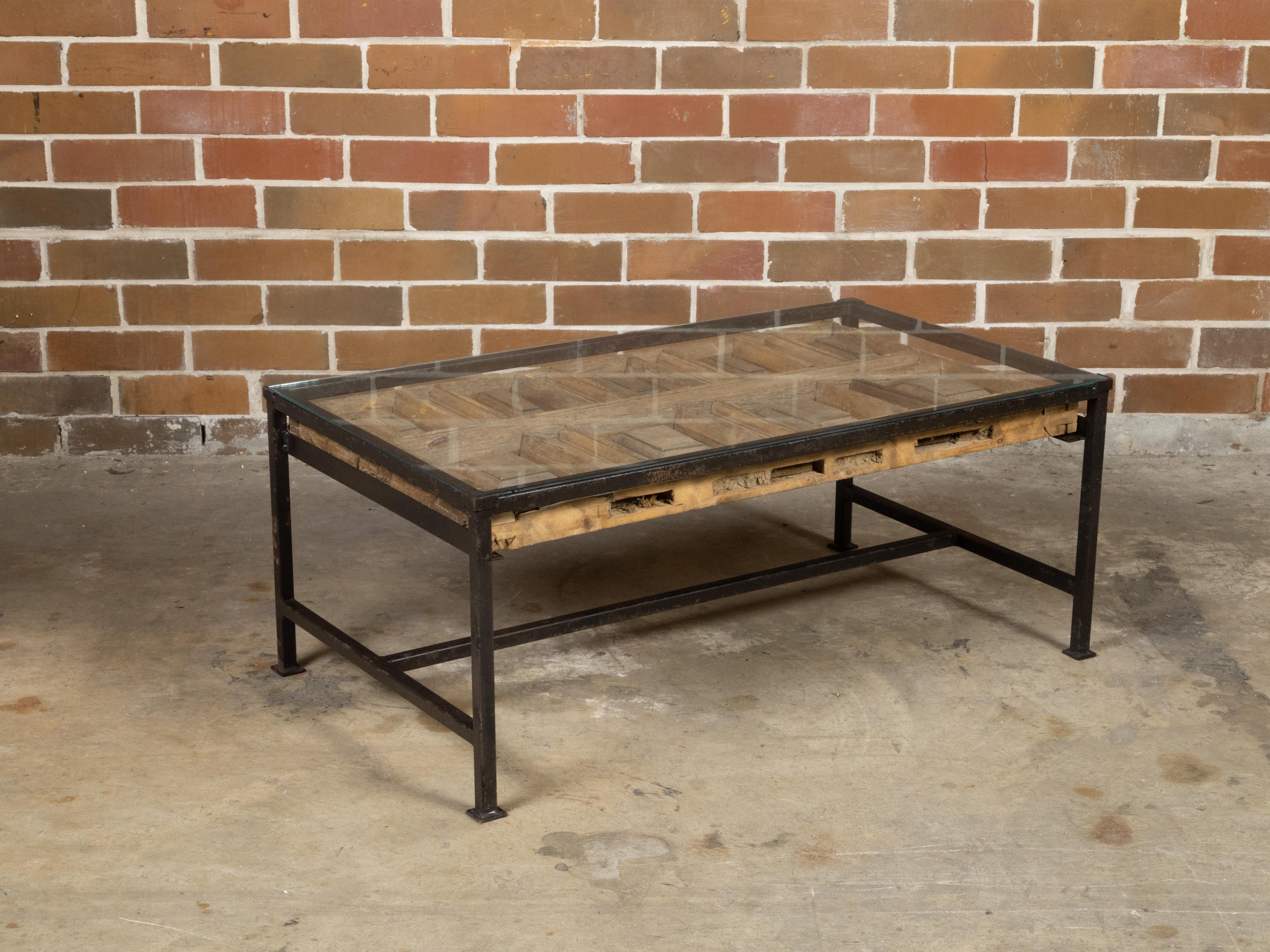 Carved Contemporary Coffee Table Made with Antique Door Fragment on Custom Iron Base For Sale