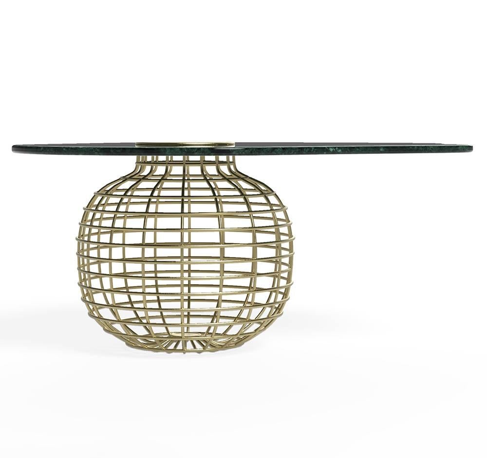 Brushed brass globe base formed of woven metal tubes.
Green Guatemalan marble organic shaped top.
This table is fully customizable. 
Please contact us if you have any questions about customization and pricing. We will be glad to check with the