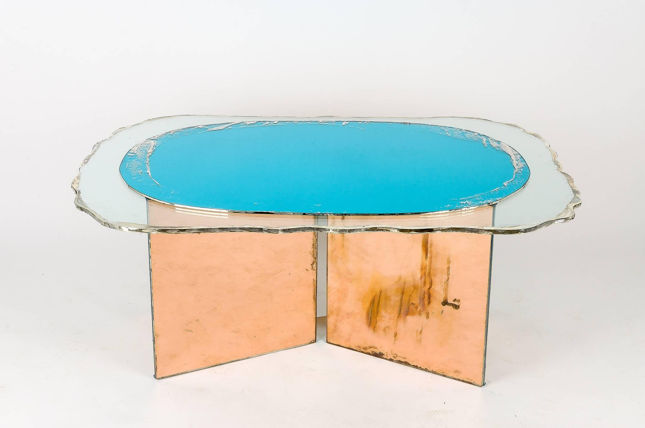 FLIGHT contemporary coffee cocktail  table, art glass silvering

This table is a piece of contemporary art, entirely made by hand in Tuscany, Italy, 100% of Italian origin. 
The table, reminiscent of wings in flight, with its colored
