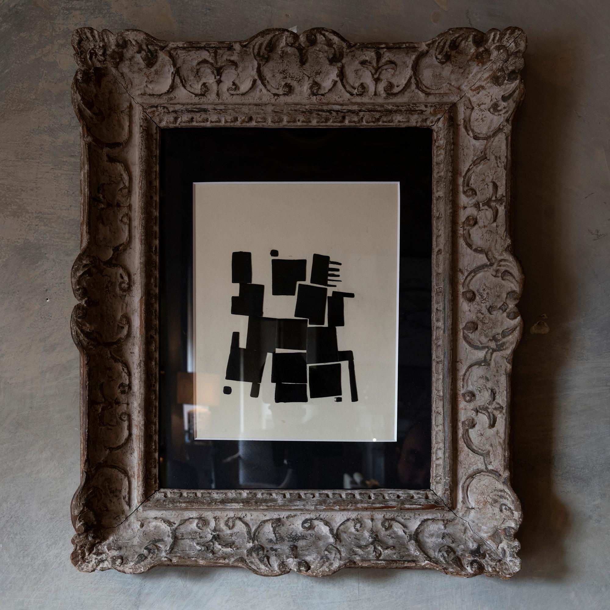 Contemporary black on white paper collage framed in a white patined wood vintage frame under glass. Italy 2022