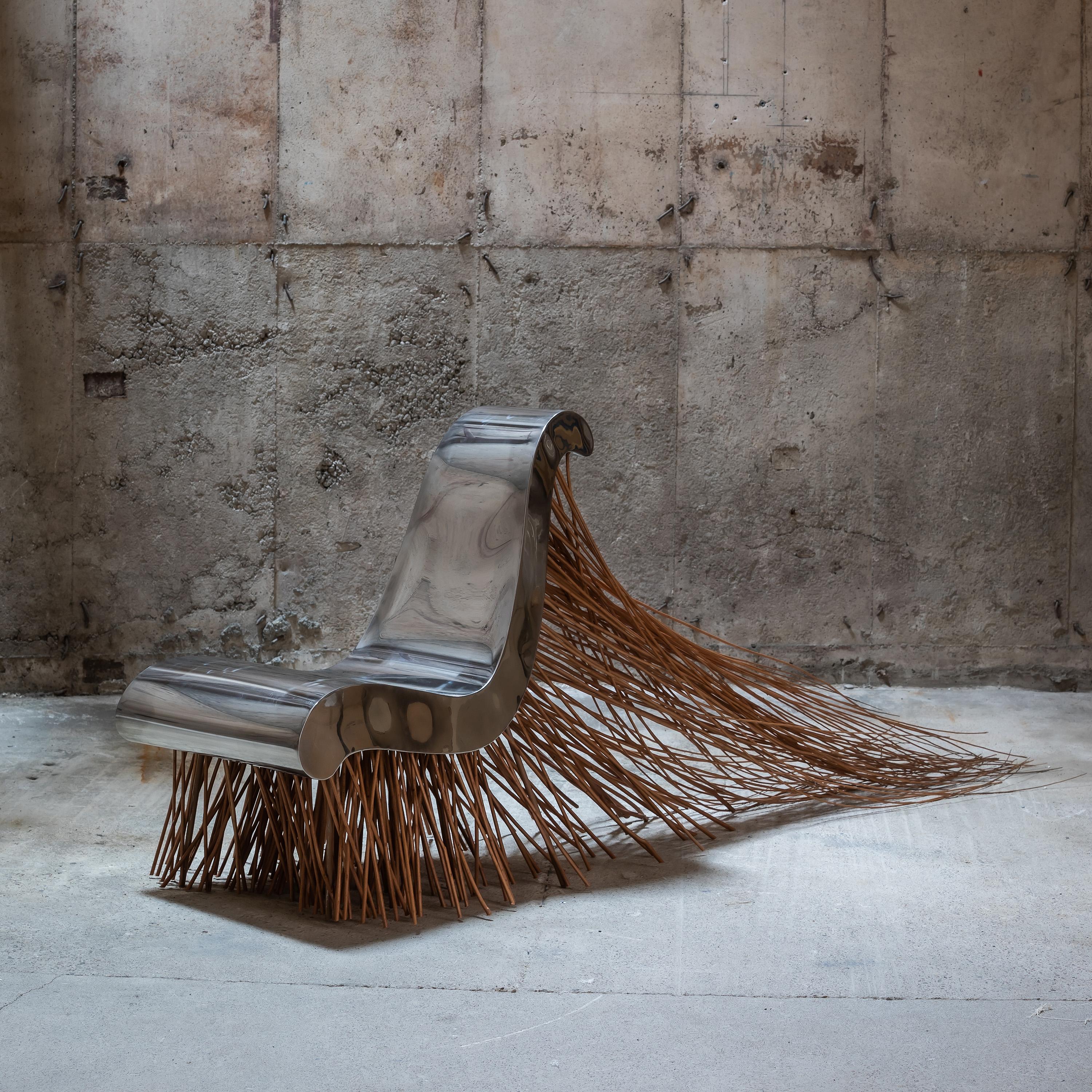 Design: Pawel Grunert, 2002

Material: Wicker, mirror polished ground acid-resistant steel
Dimensions: 60 x 230 x H 90 cm

Made by hand, in Poland.

Pawel Grunert:
Born in Warsaw in 1965, Pawel Grunert is a designer, creator of artistic furniture