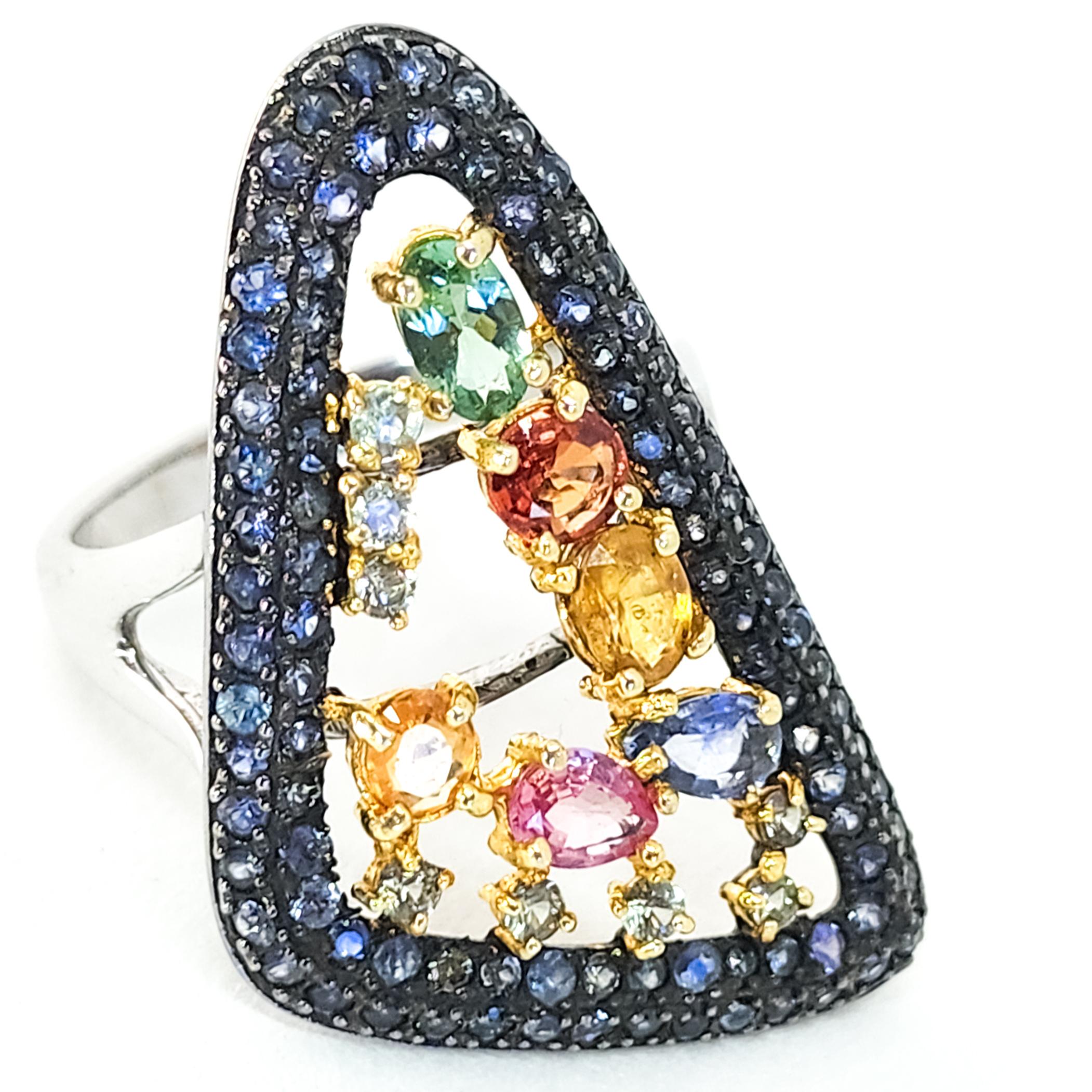 One large Cocktail, Cluster Ring featuring a Deliciously Sweet Confectionery of Colored Gemstones in Pinks, Blues, Yellows, Oranges and Purples and 2.85 carats total weight. This festive Ring is an appropriate accent for all seasons wear.  The Large